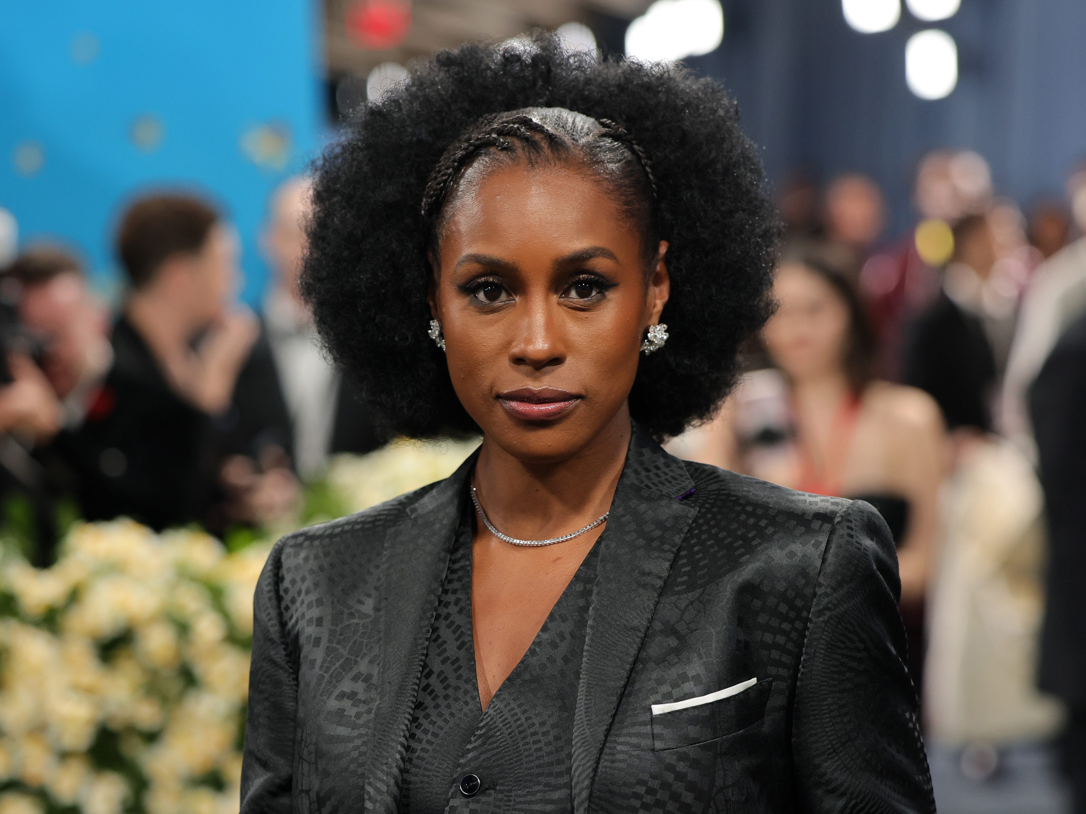 Issa Rae posing on the carpet of the 2025 Met Gala Celebrating "Superfine: Tailoring Black Style."
