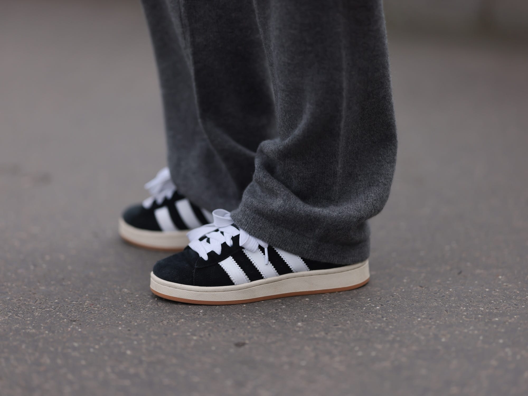 Sonia Lyson seen wearing Sporty & Rich grey cashmere grey jogging pants and Adidas black leather Campus sneakers, on April 10, 2024 in Berlin, Germany.