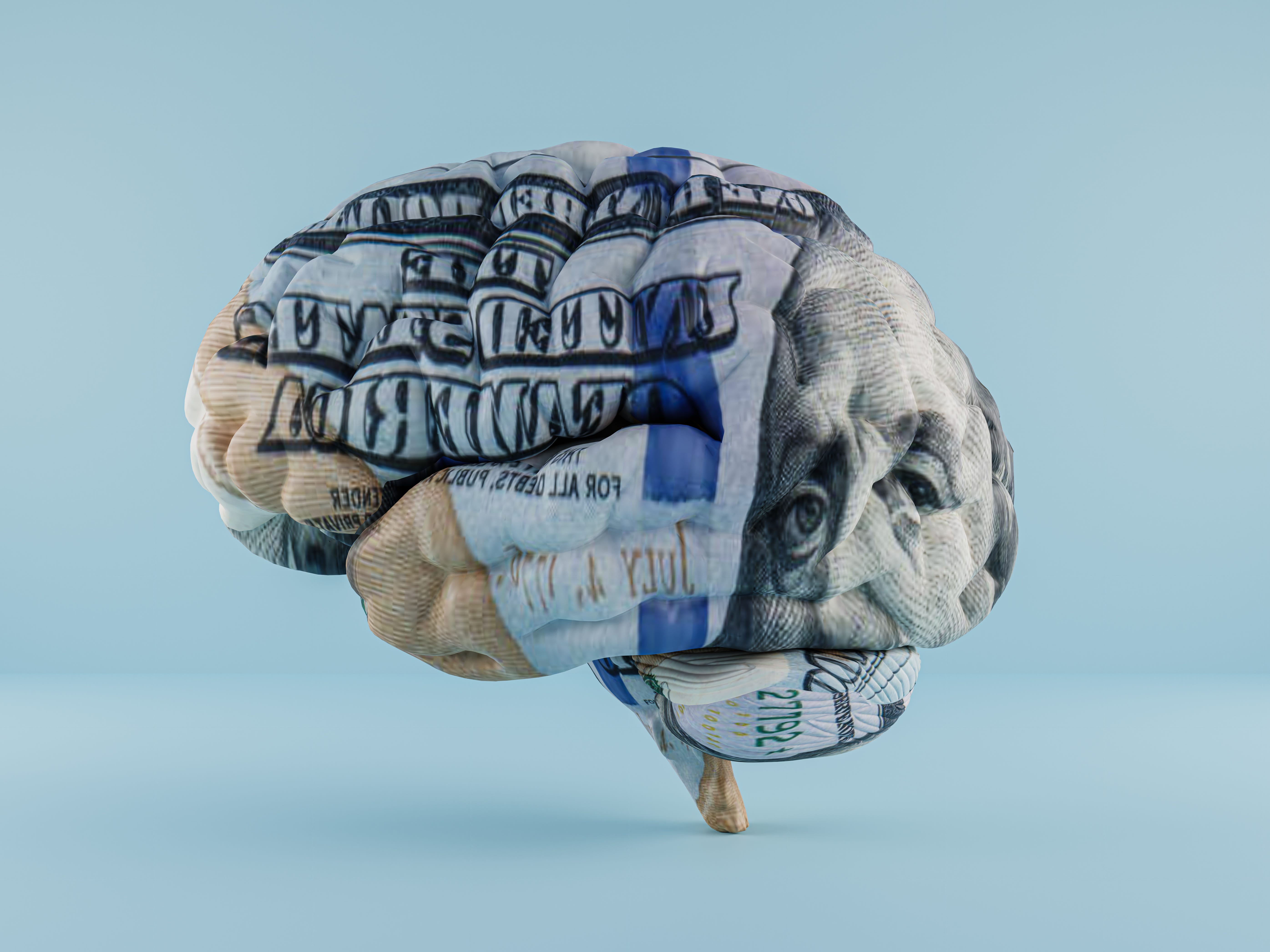 Graphic of a brain with $100 bill projected onto it