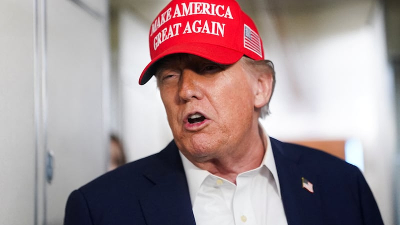 Donald Trump speaks to members of the media on board Air Force One on the way to New Jersey, U.S., July 4, 2025.