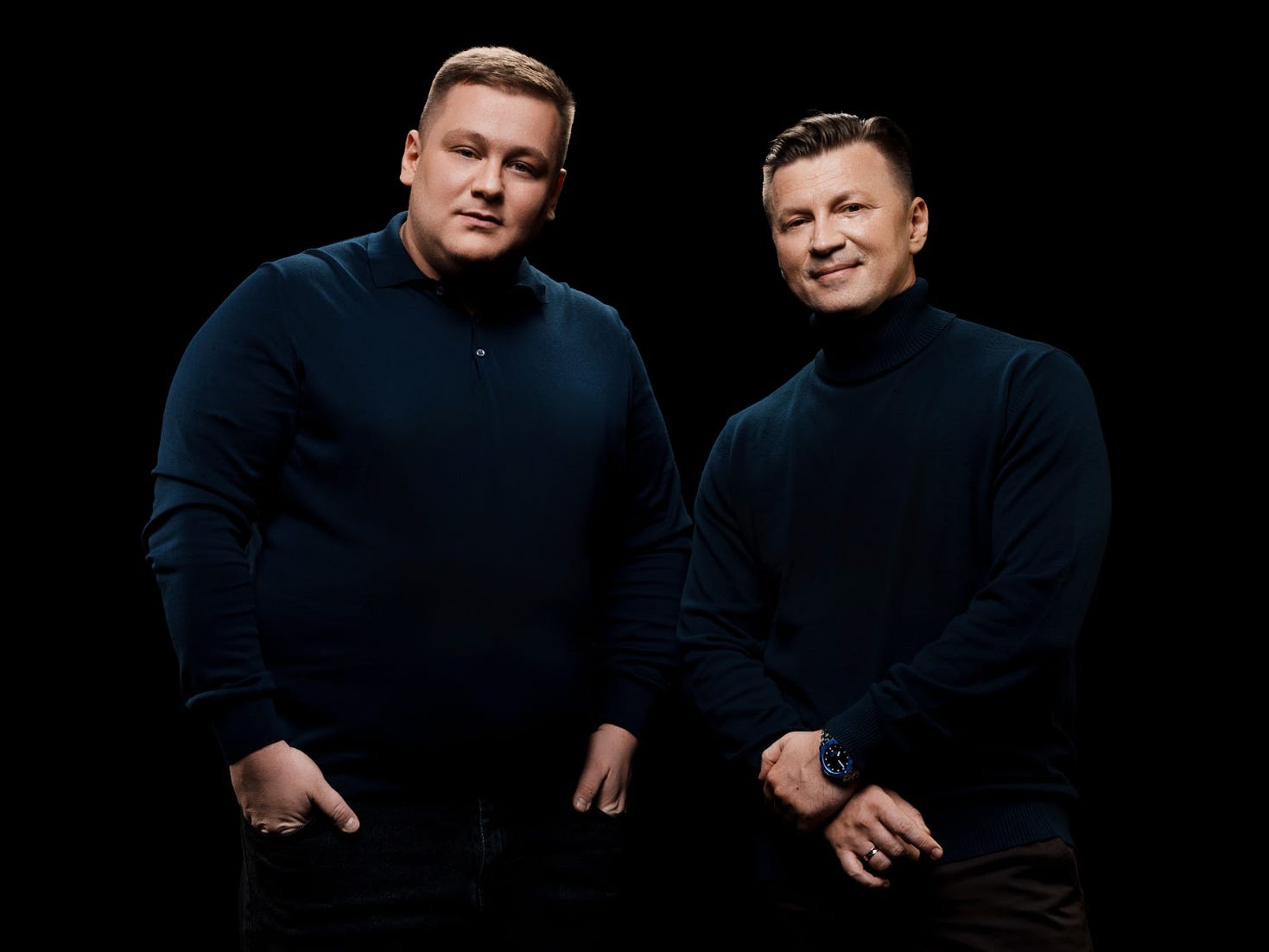 XPANCEO cofounders Roman Axelrod and Dr. Valentyn Volkov, both wearing black sweaters and standing in front of a black background.
