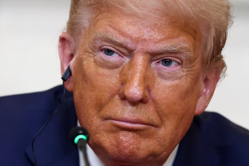 U.S. President Donald Trump listens to opening remarks, on the day he hosts a lunch for African representatives of Gabon, Guinea-Bissau, Liberia, Mauritania, and Senegal in the State Dining Room at the White House in Washington, D.C., U.S., July 9, 2025. REUTERS/Kevin Lamarque