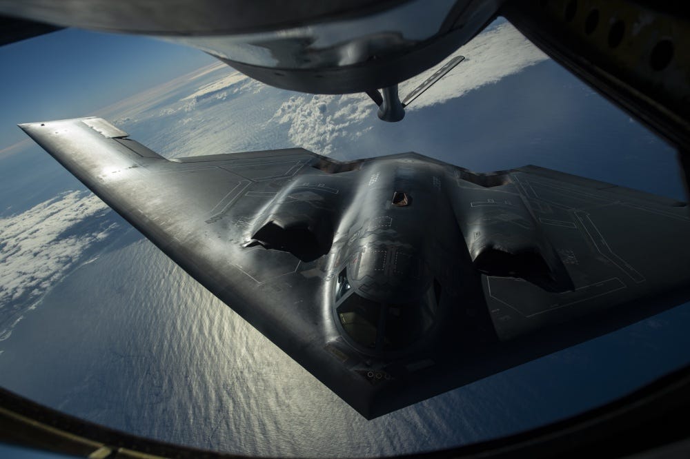 A B-2 Spirit bomber deployed from Whiteman Air Force Base, Missouri, conducts aerial refueling near Joint Base Pearl Harbor-Hickam, Hawaii, during an interoperability training mission Jan. 15, 2019. The aircraft are flying in support of a U.S. Strategic Command Bomber Task Force mission.