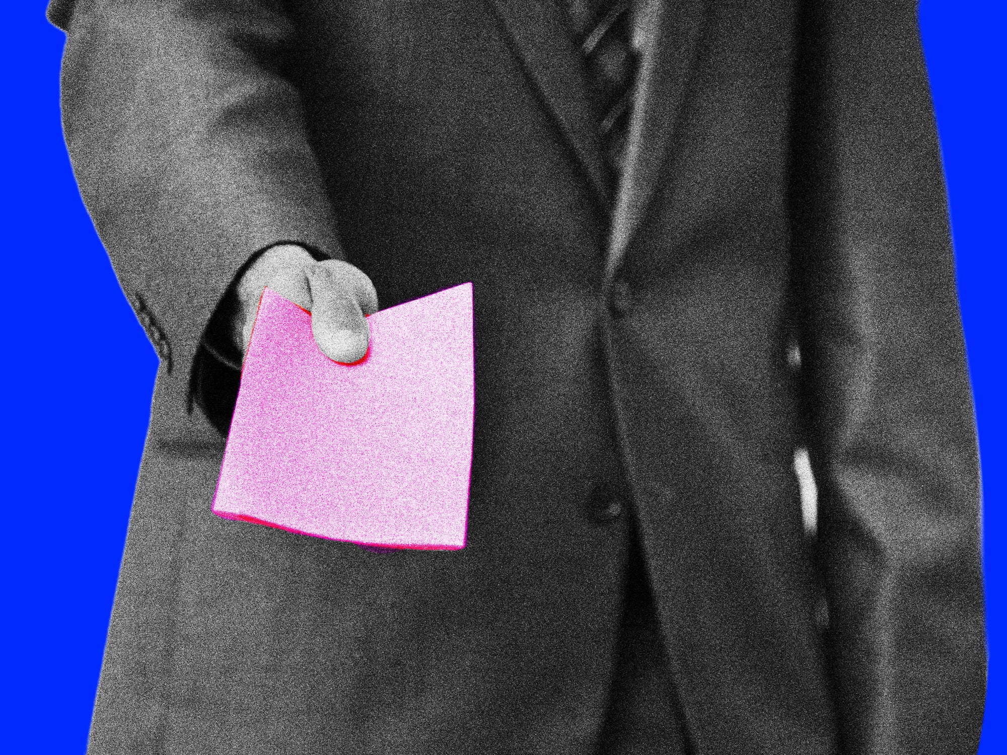 Man in business suit presenting pink slip