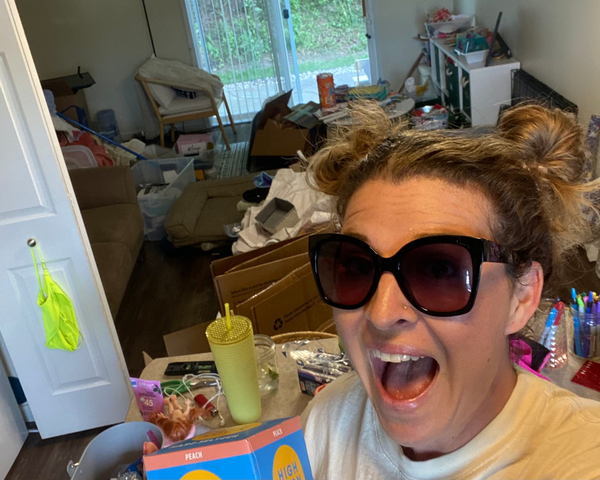 a selfie of a woman and her living space