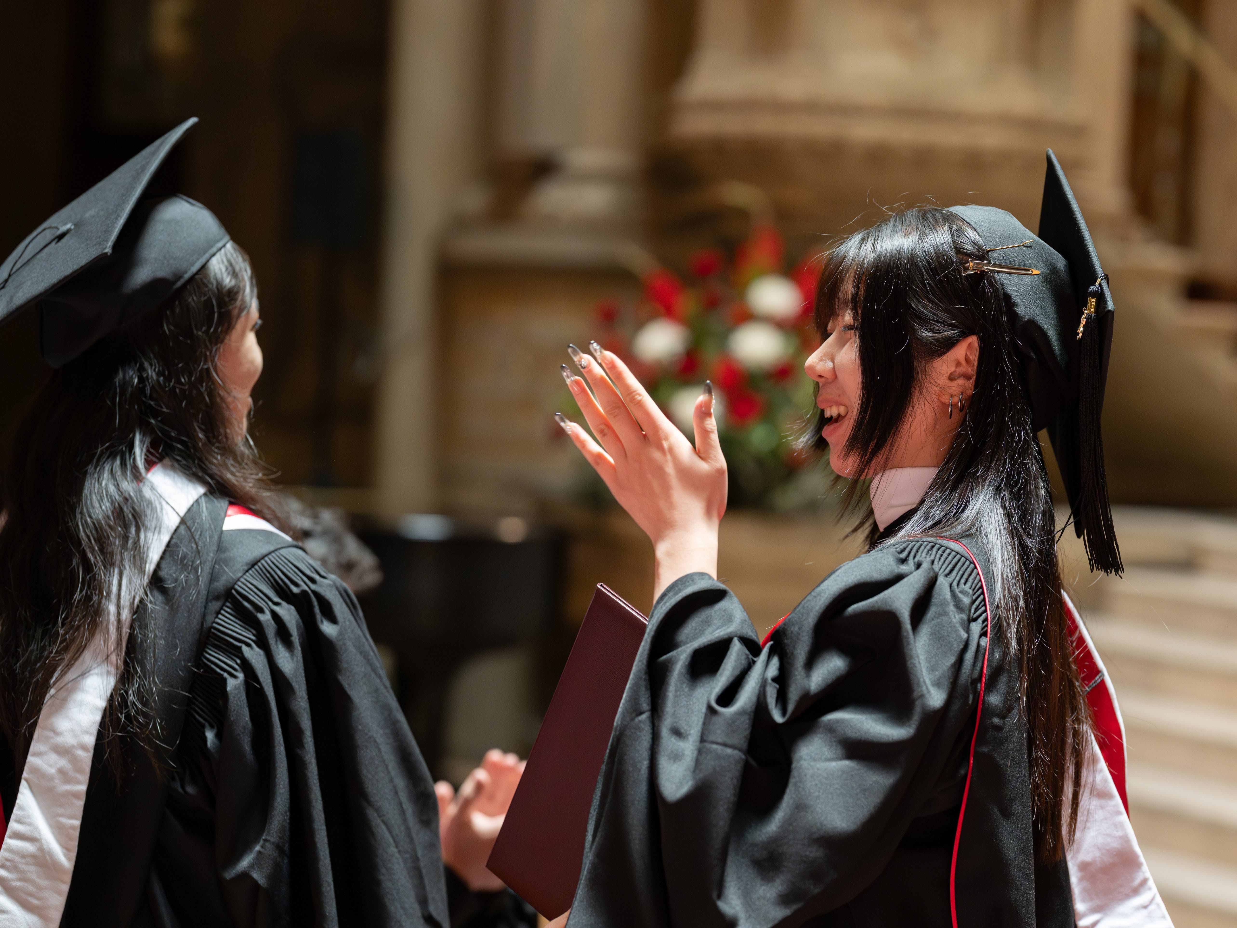 Emma Wang at her standford graduating wearing grad gown