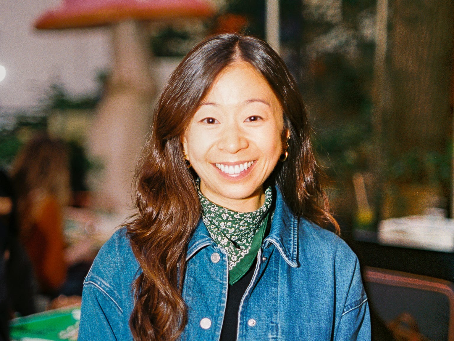 headshot of a woman in a denim shirt