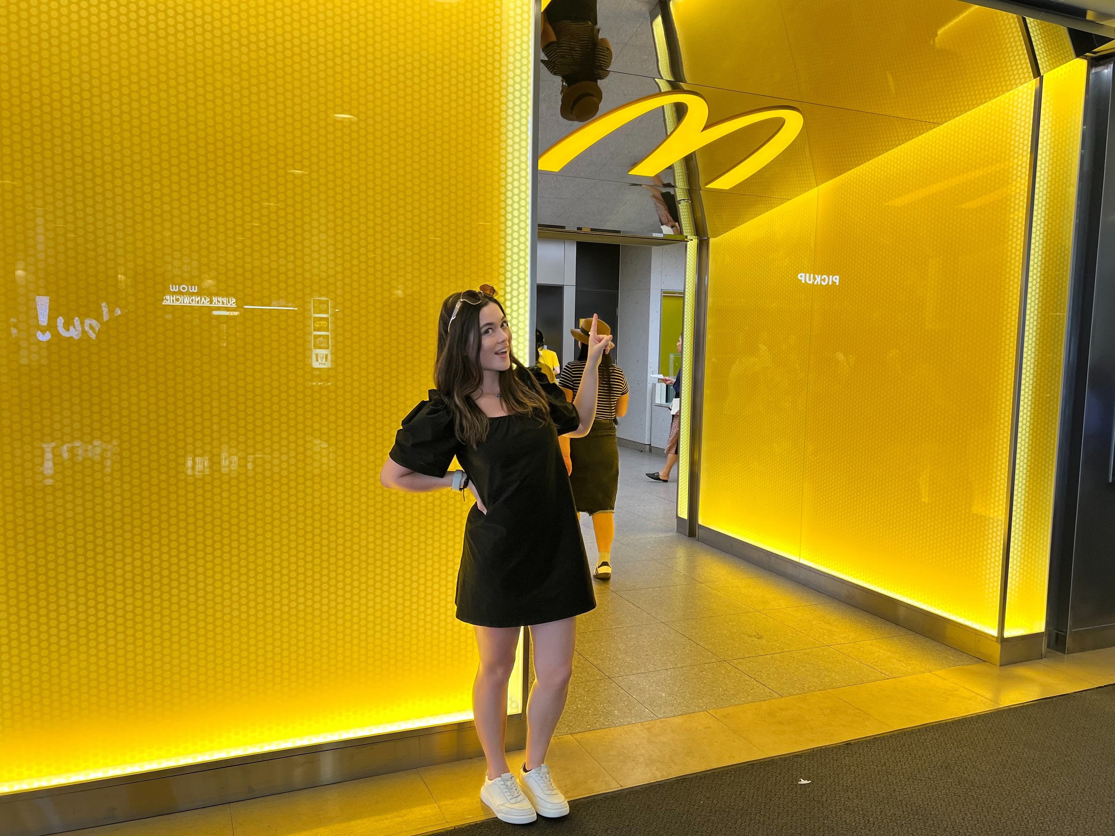 A woman standing outside Hong Kong's Admiralty Centre McDonald's.