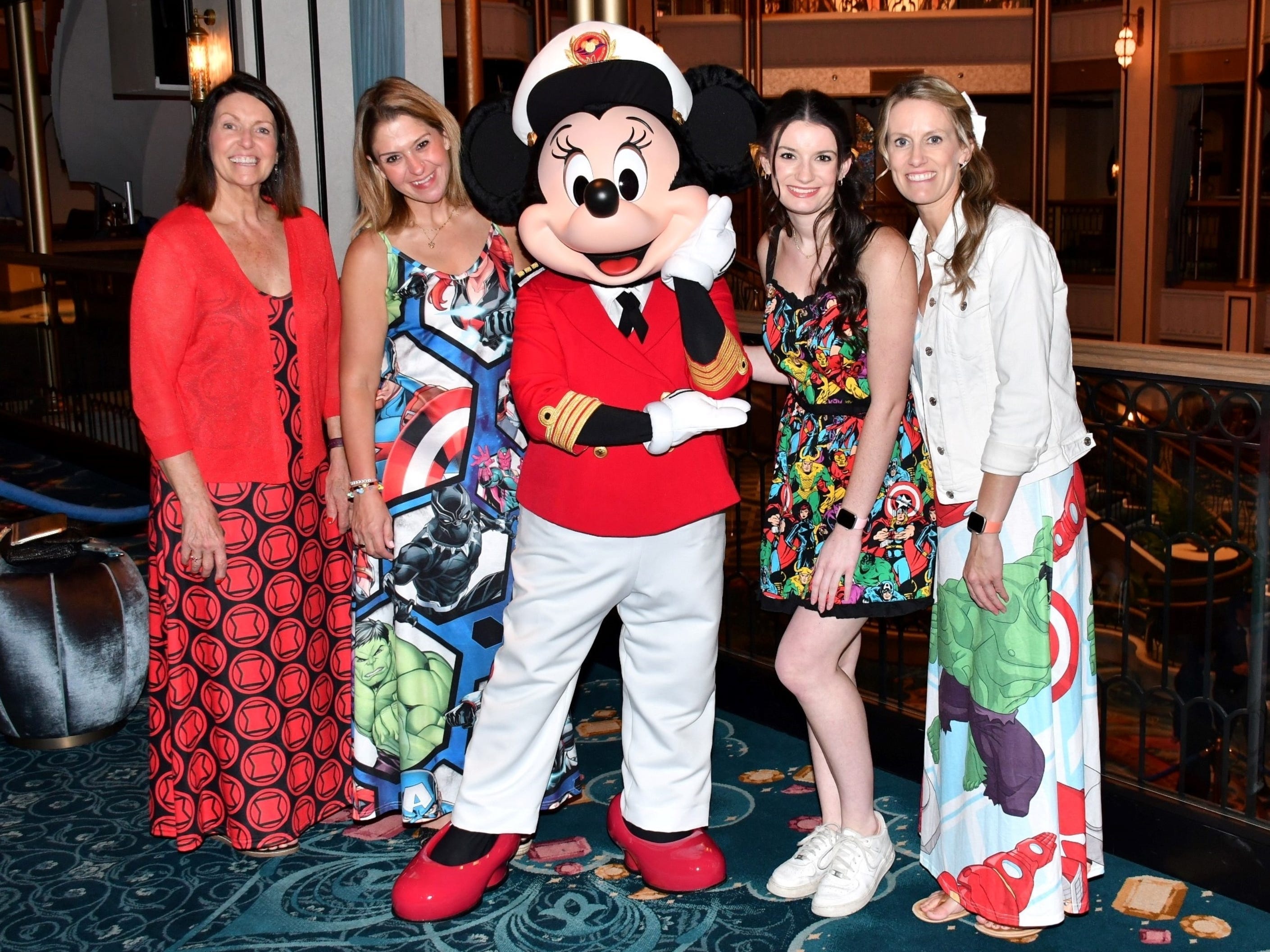 The author and her friends posing with Captain Minnie on the Disney Treasure.
