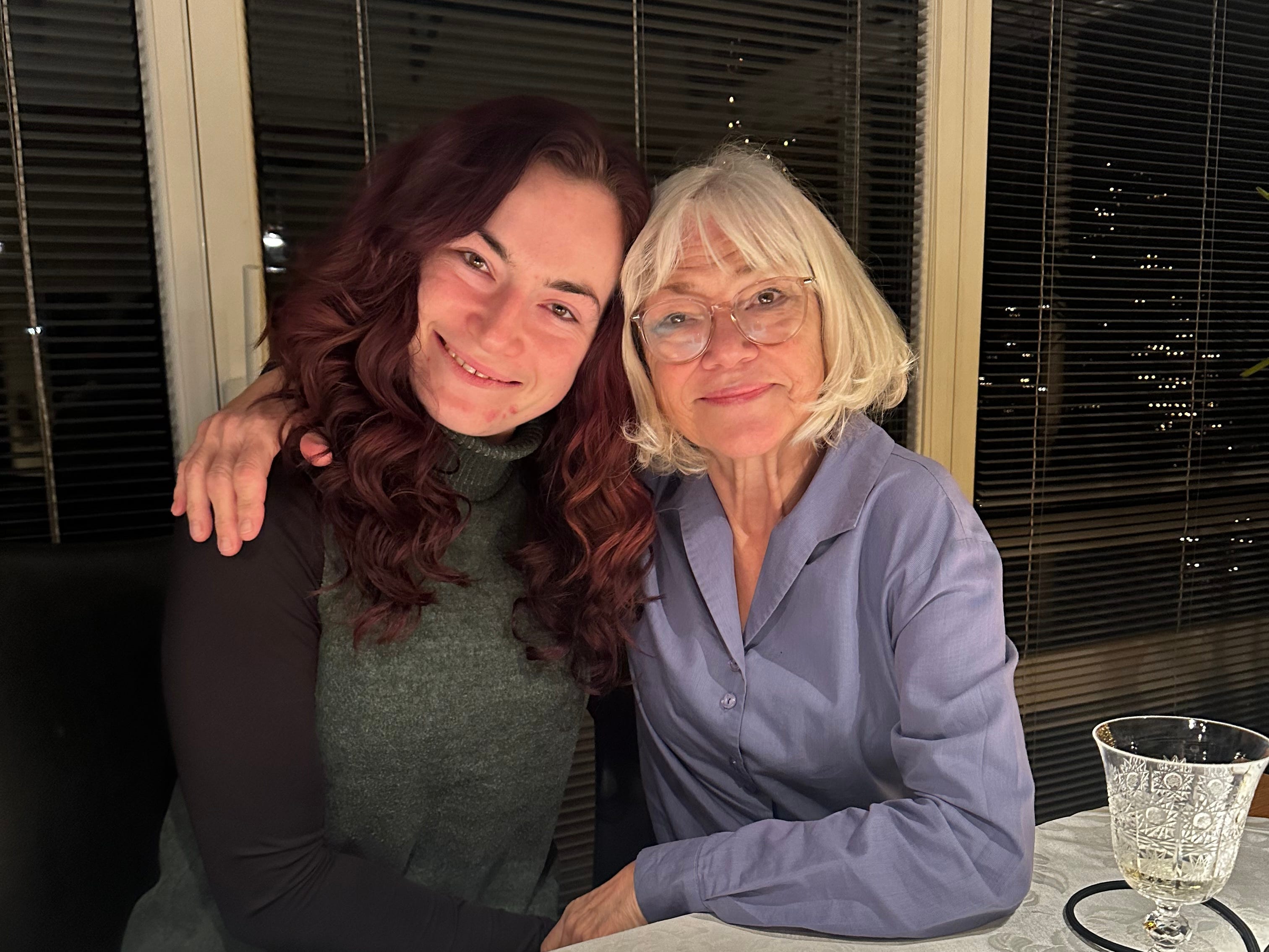 The author and her mom sitting at the table around the holidays.