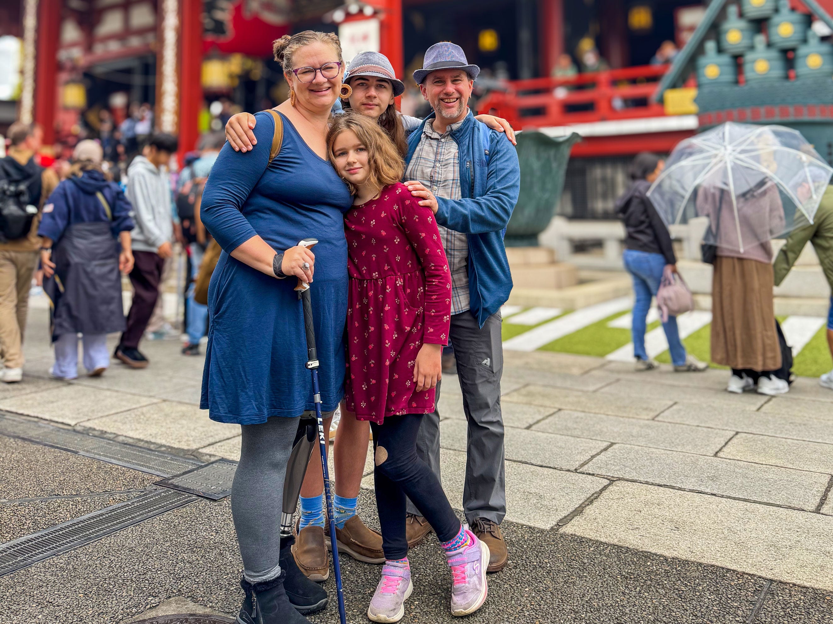 Anthony and his family pose for a photo while traveling.