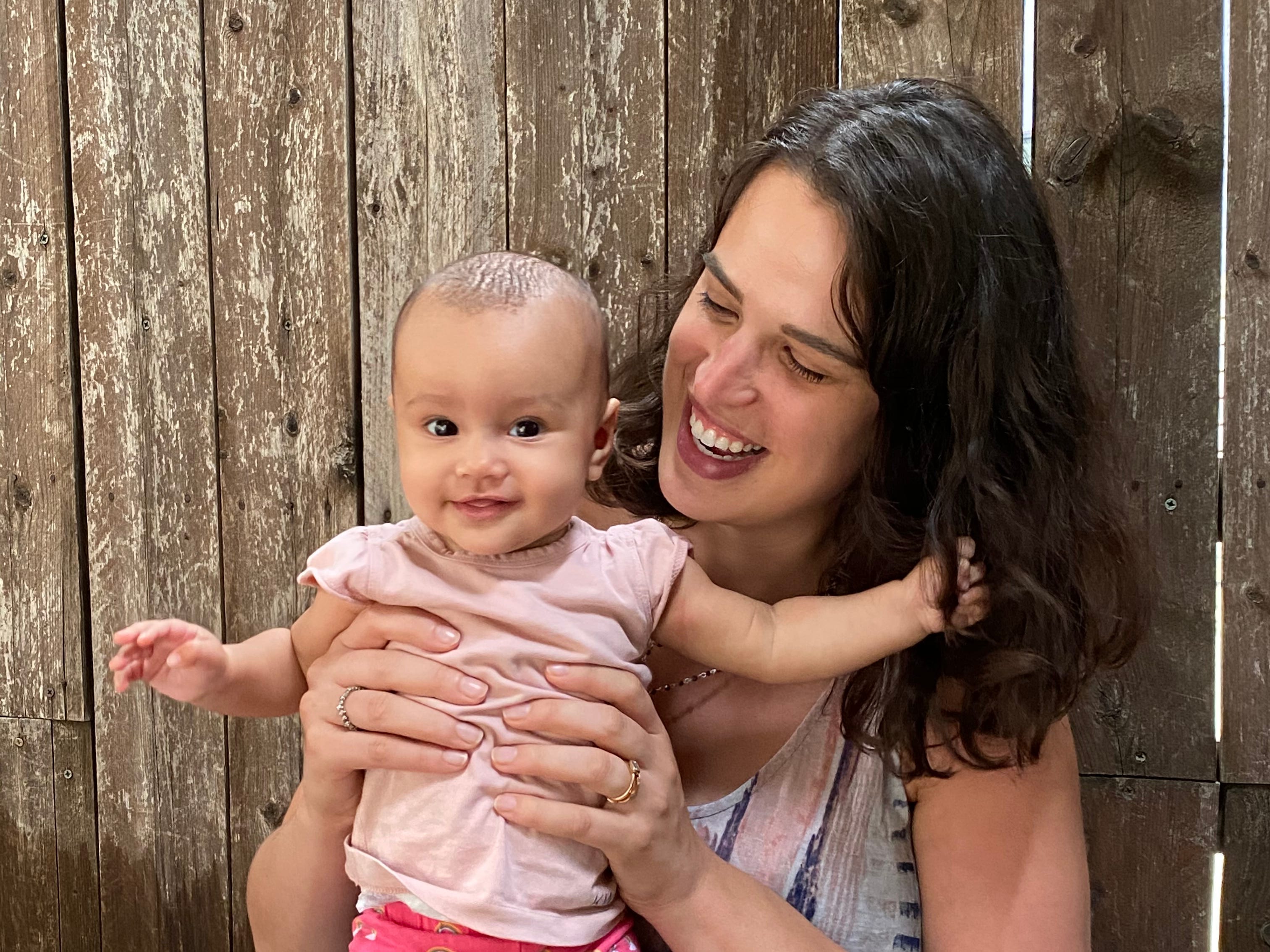 The author holding her baby Simone.
