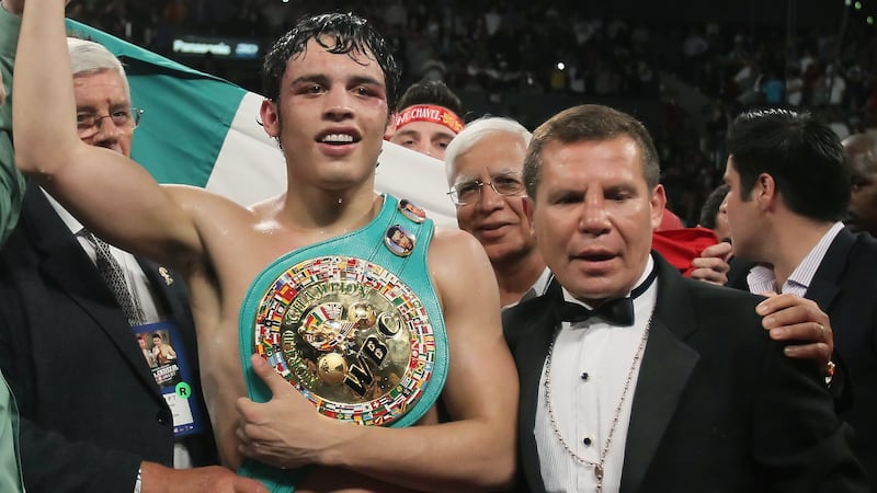 LOS ANGELES, CA - JUNE 04: (R-L) Referee Jack Reiss, Julio Cesar Chavez Jr. of Mexico and Julio Cesar Chavez Sr. of Mexico pose following the WBC World Middleweight Title bout with Sebastian Zbik of Germany at Staples Center on June 4, 2011 in Los Angeles, California. (Photo by Jeff Gross/Getty Images)