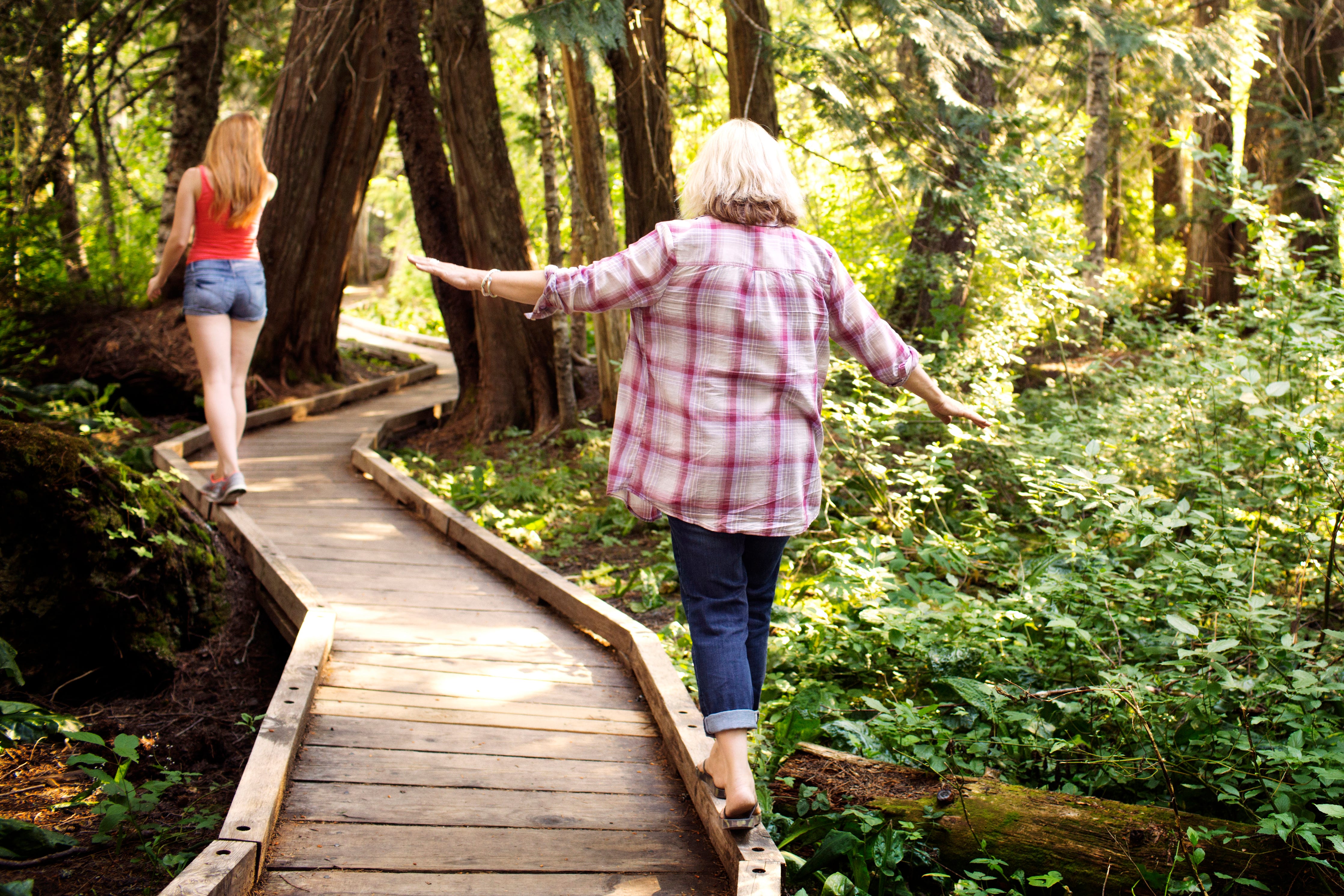 Two women walking in the woods
