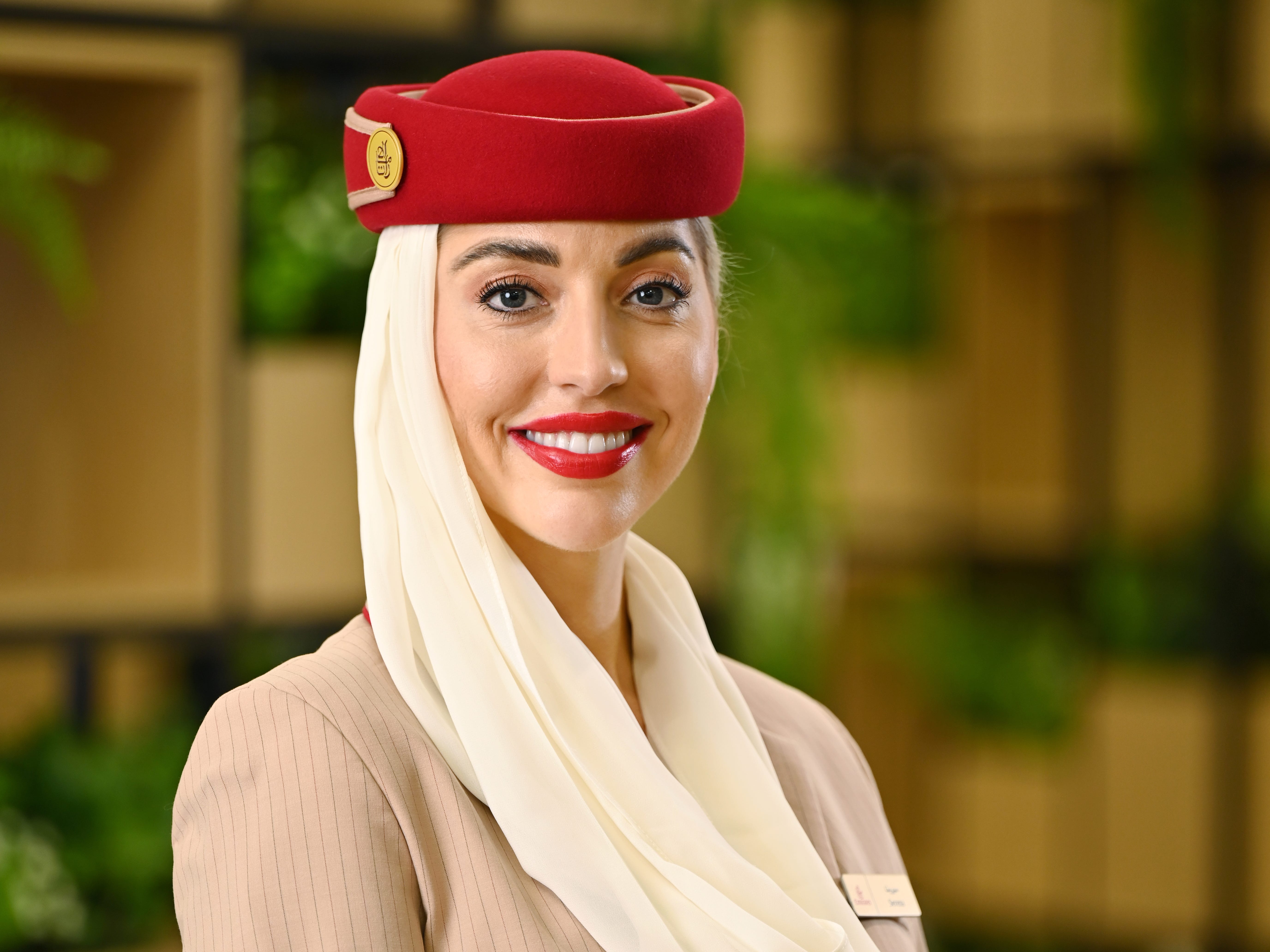 Serena Williams, a flight attendant for Emirates in uniform.
