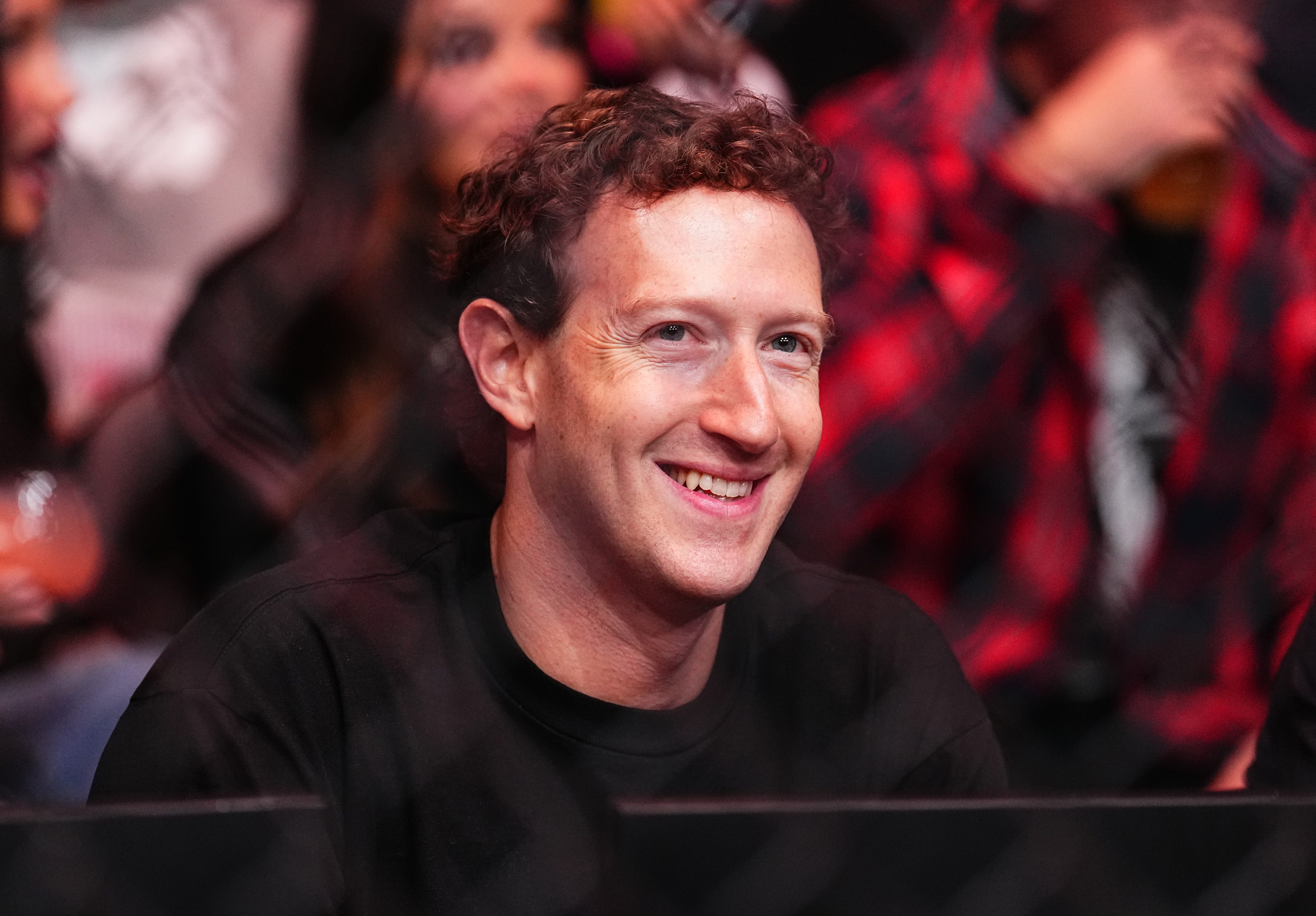 Mark Zuckerberg smiling while attending the UFC 298 event at Honda Center in Anaheim, California.