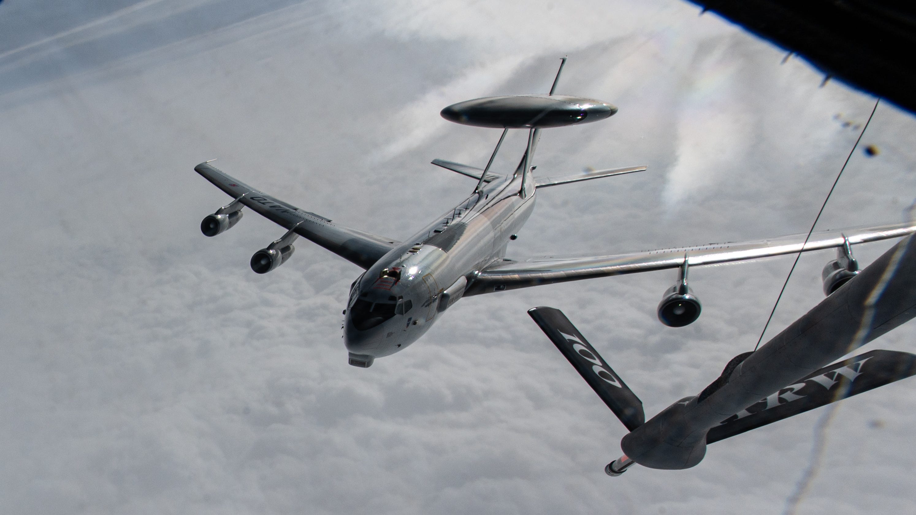 A NATO E-3 Sentry descends from a KC-135 Stratotanker from the 100th Air Refueling Wing after an aerial refueling mission over Romania, March 1, 2025.