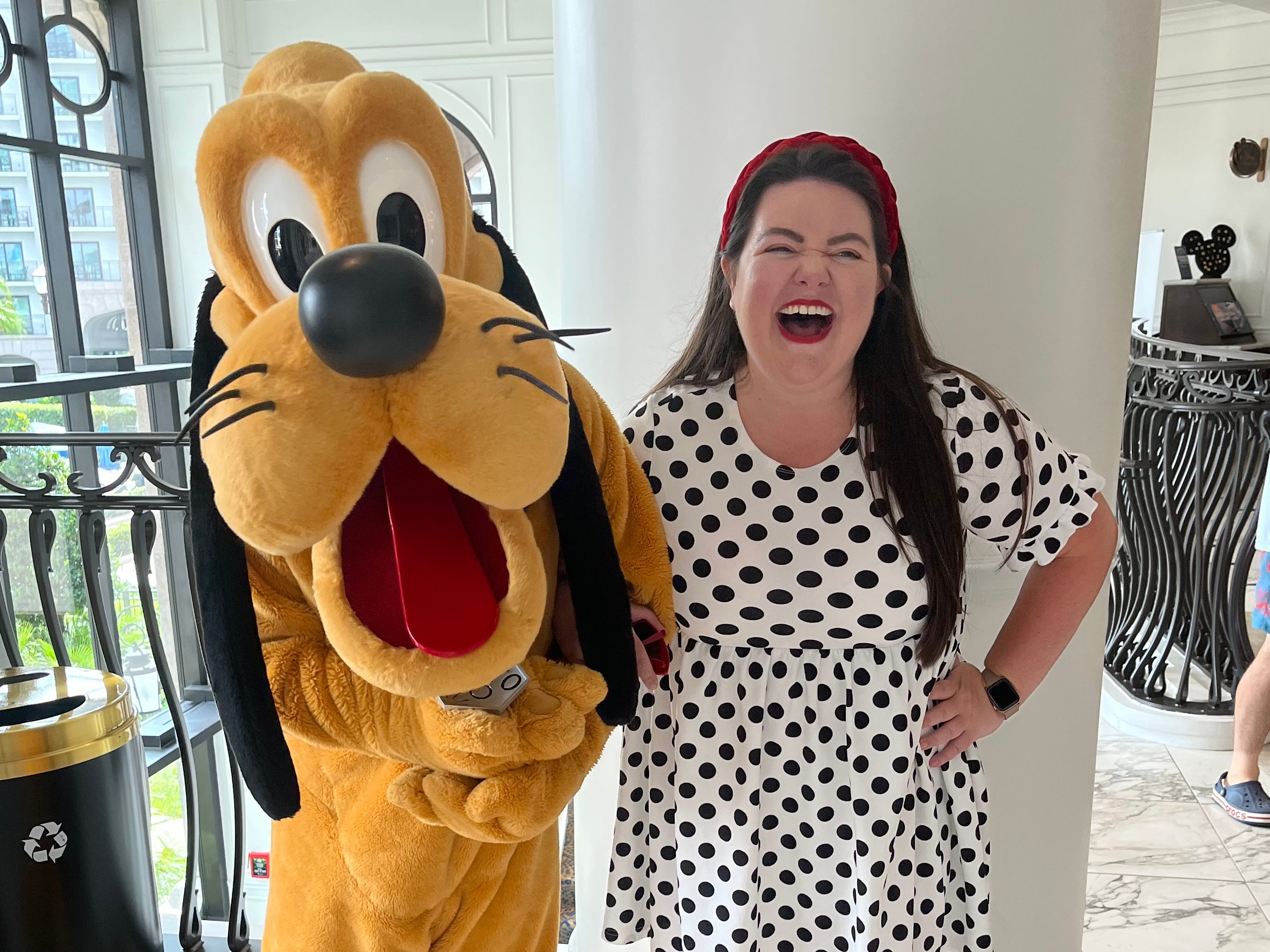 Author Megan dubois with pluto in lobby of Disney's Riviera Resort