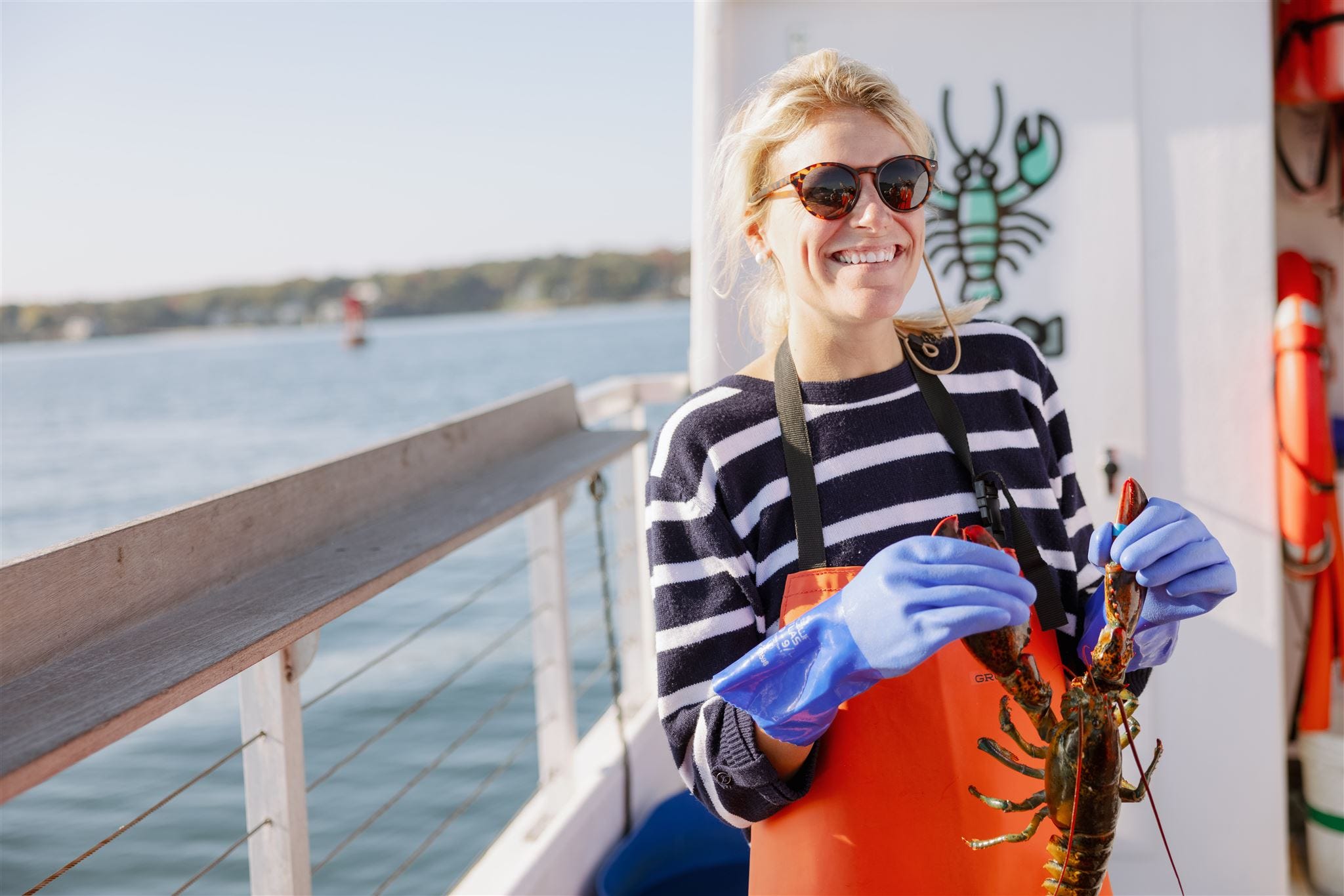 Katherine Parker-Magyar smiling on boat in Maine