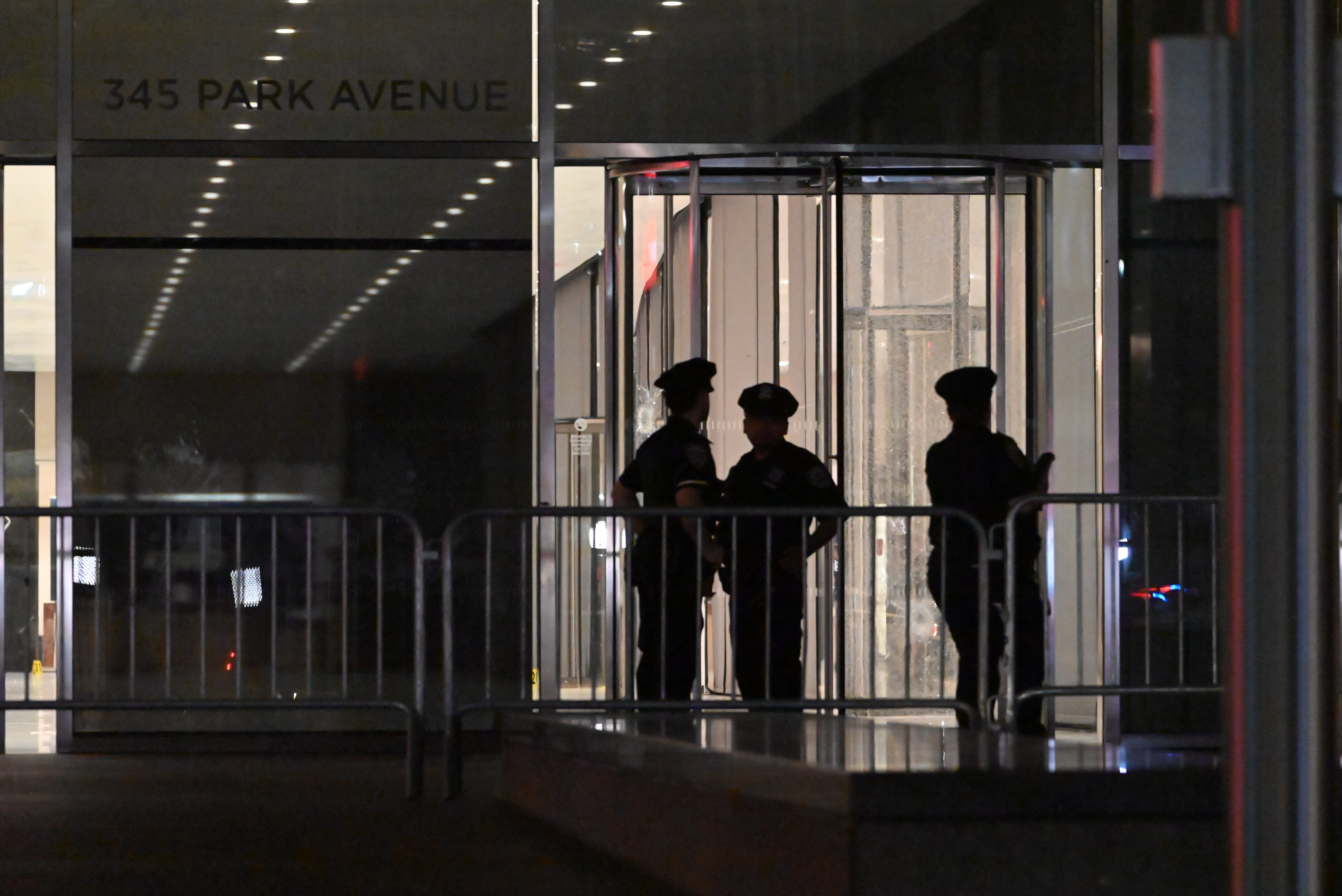 Silhouette of police outside 345 Park Avenue
