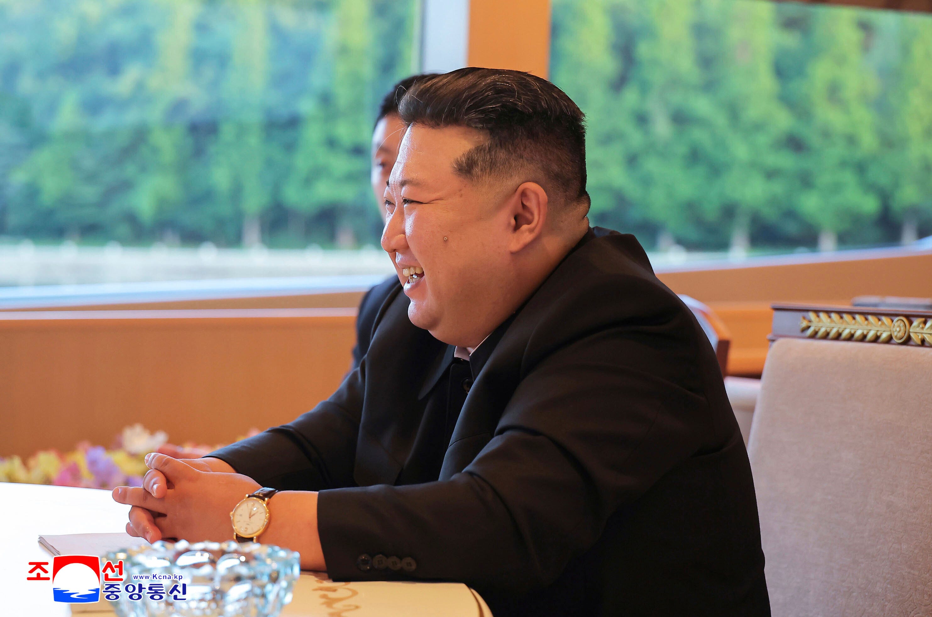 Kim Jong Un laughs as he speaks with Russia's foreign minister, Sergey Lavrov.