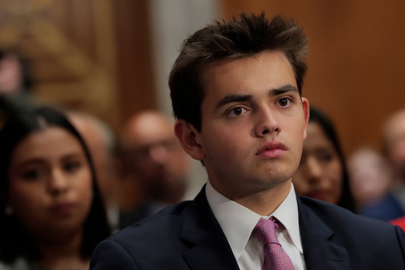 Donald Trump III, 16, was seated directly behind Kimberly Guilfoyle during her confirmation hearing on Thursday.