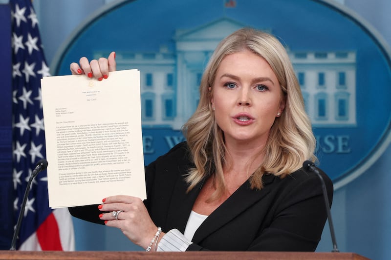 White House Press Secretary Karoline Leavitt shows a letter on tariffs from Trump to Japanese Prime Minister Shigeru Ishiba.