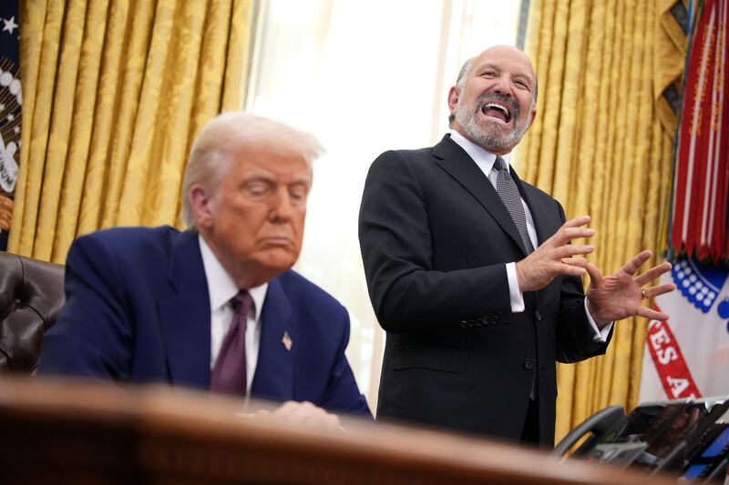 Secretary of Commerce Howard Lutnick speaks alongside President Donald Trump after Trump signed an executive order on "reciprocal" tariffs in the Oval Office at the White House on Feb. 13.