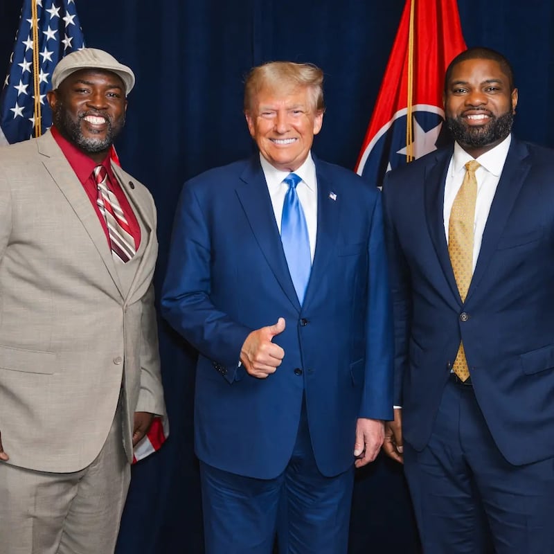 Larry Wilcoxson, left, poses with President Donald Trump and Rep. Byron Donalds.