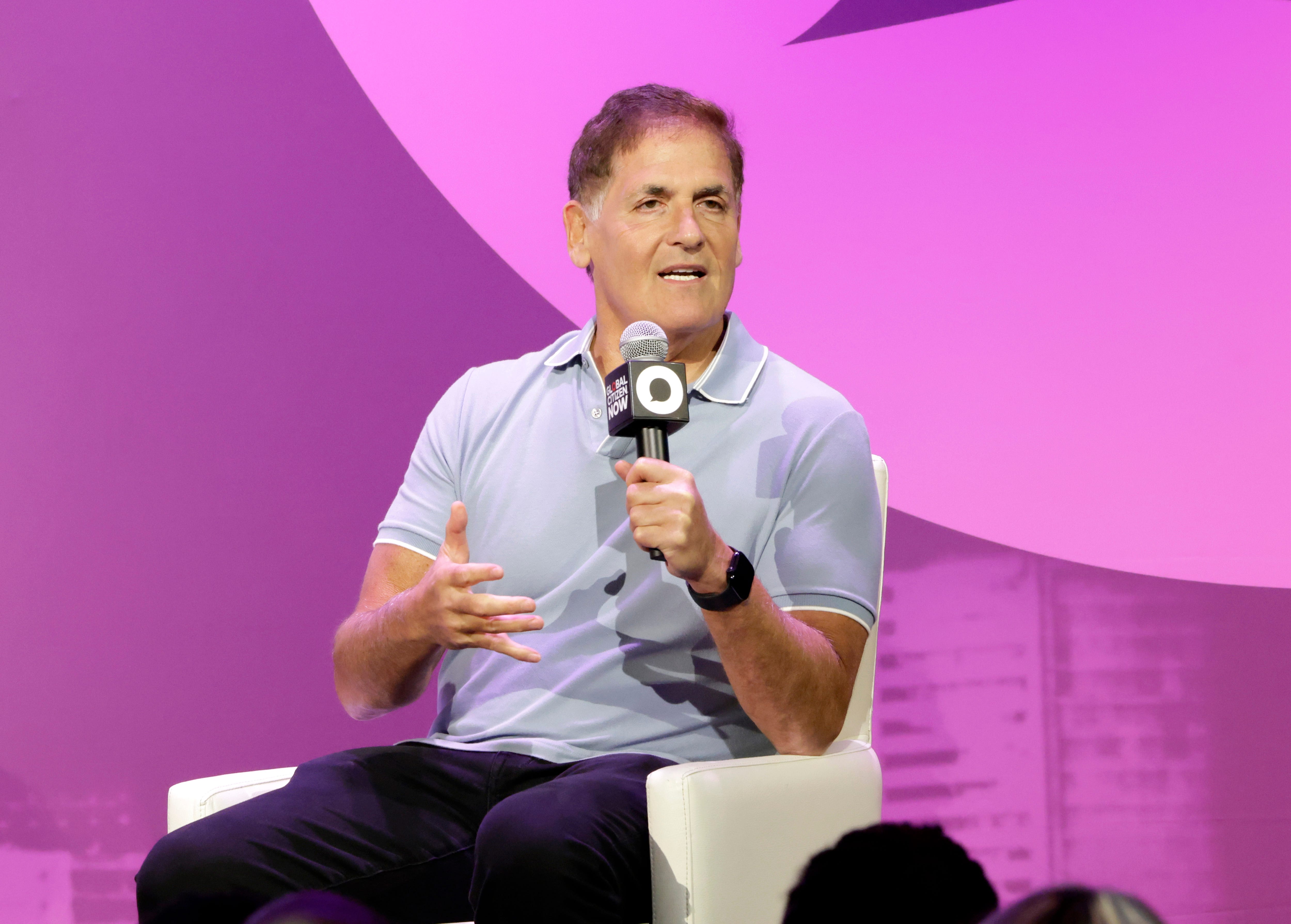 Mark Cuban speaking onstage at an event.