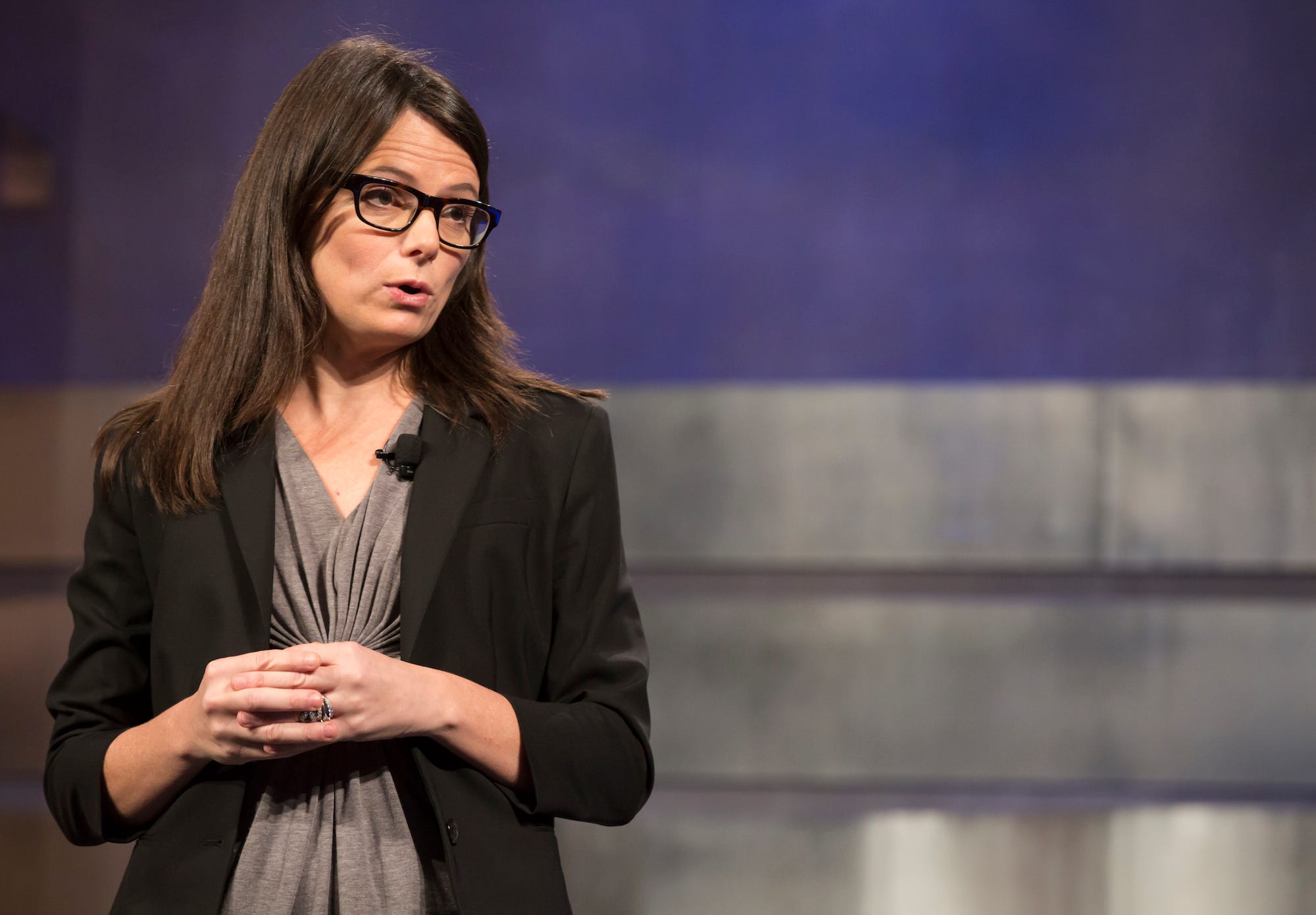 Amy Hood, Microsoft's chief financial officer, standing on a stage and speaking.