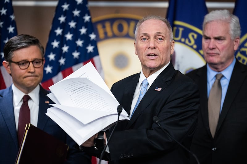 House Majority Leader Steve Scalise, R-La., holds the House Republicans budget during a news conference in the Capitol Visitor Center after a meeting of the conference on Tuesday, February 25, 2025. Speaker of the House Mike Johnson, R-La., left, and House Majority Whip Tom Emmer, R-Minn., also appear.