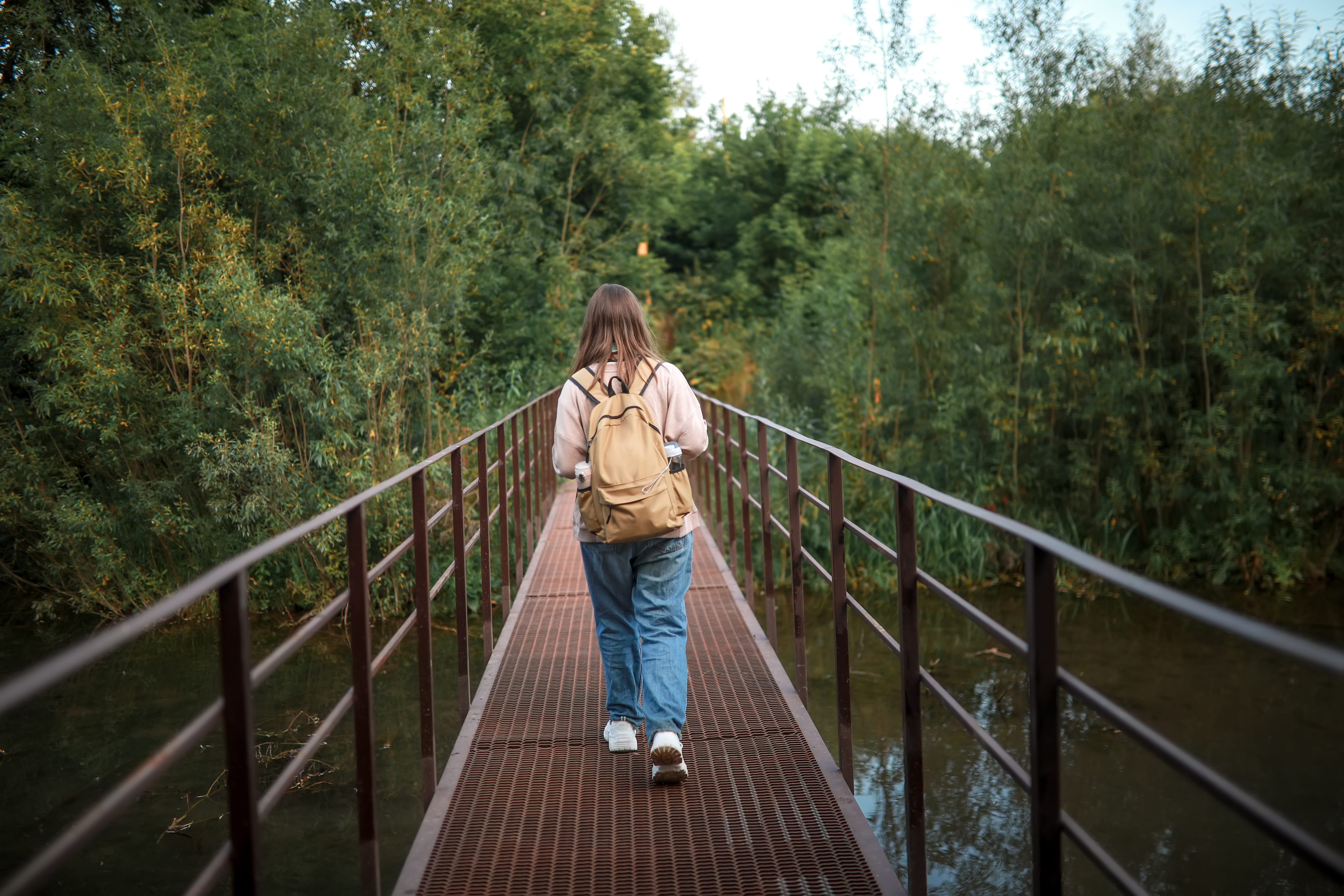 A girl hiking in the woods.