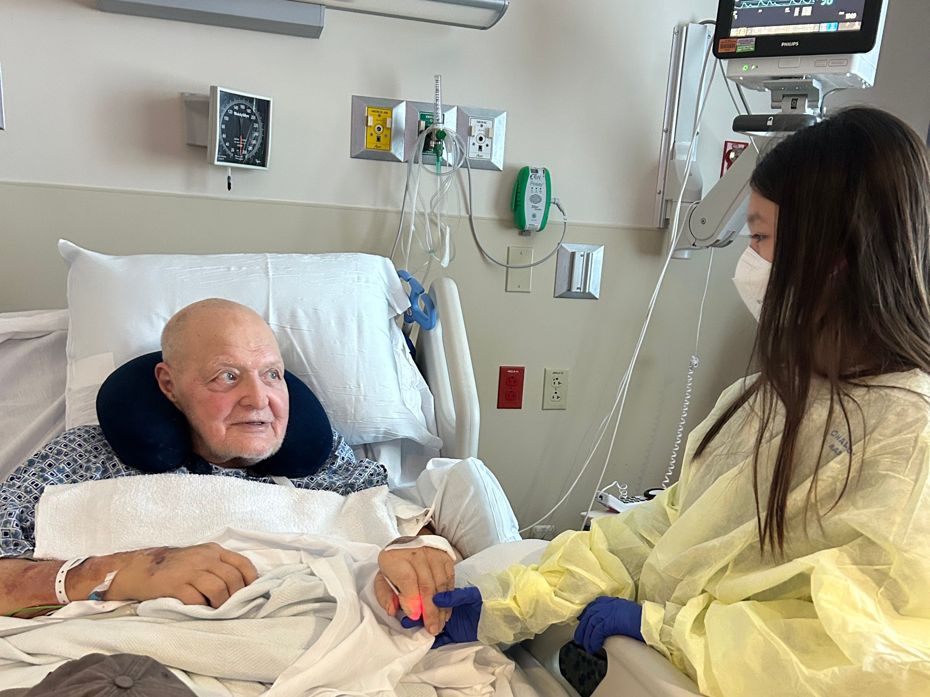 Grandfather holding hands with granddaughter