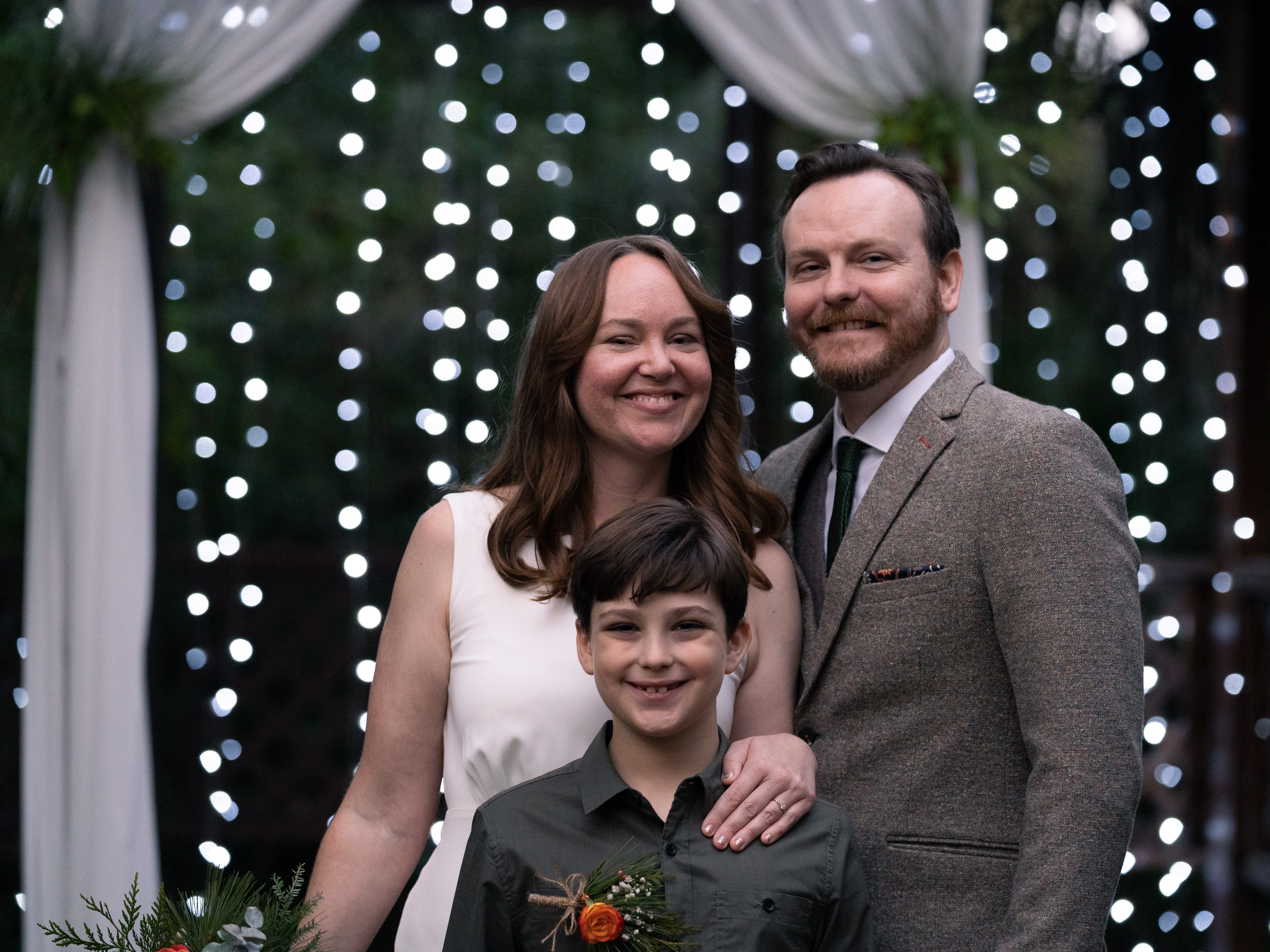 Ashley Archambault poses with her son and husband.