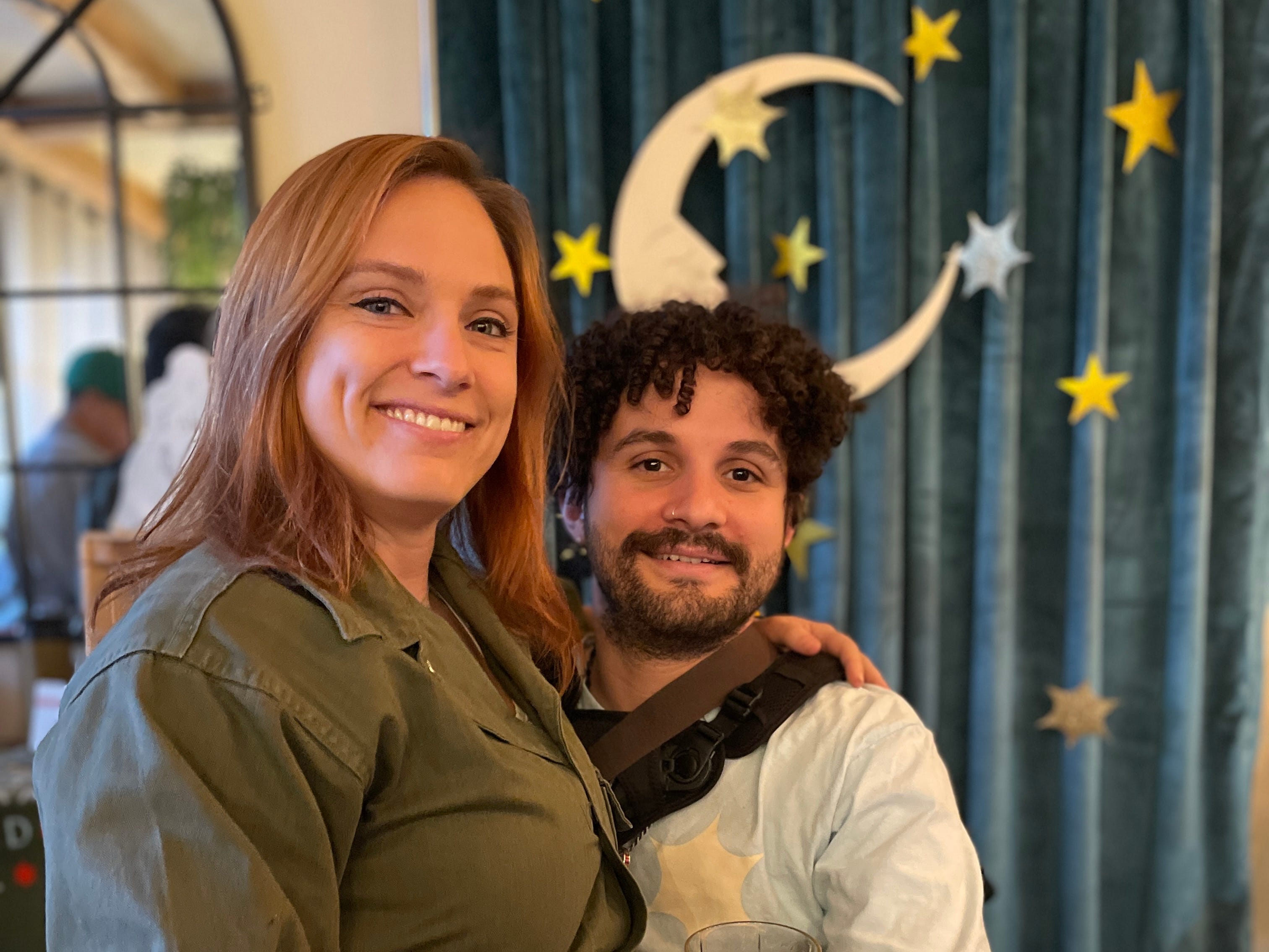 The author and her husband smiling and looking at the camera at a music venue.