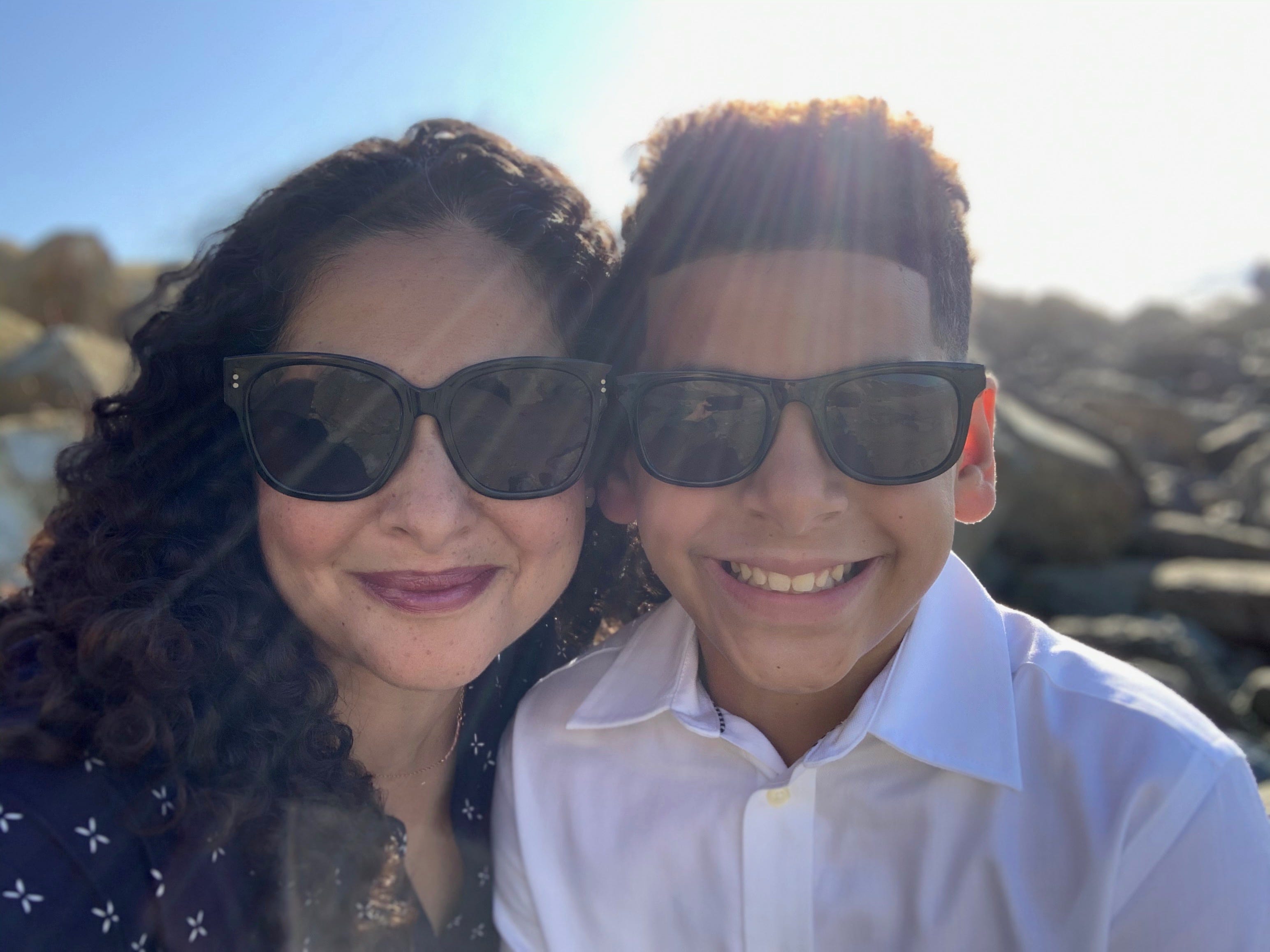 Chris Rosenberg with son, both wearing sunglasses outside