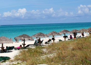 Mystery deepens as body discovered during search for missing American in island paradise