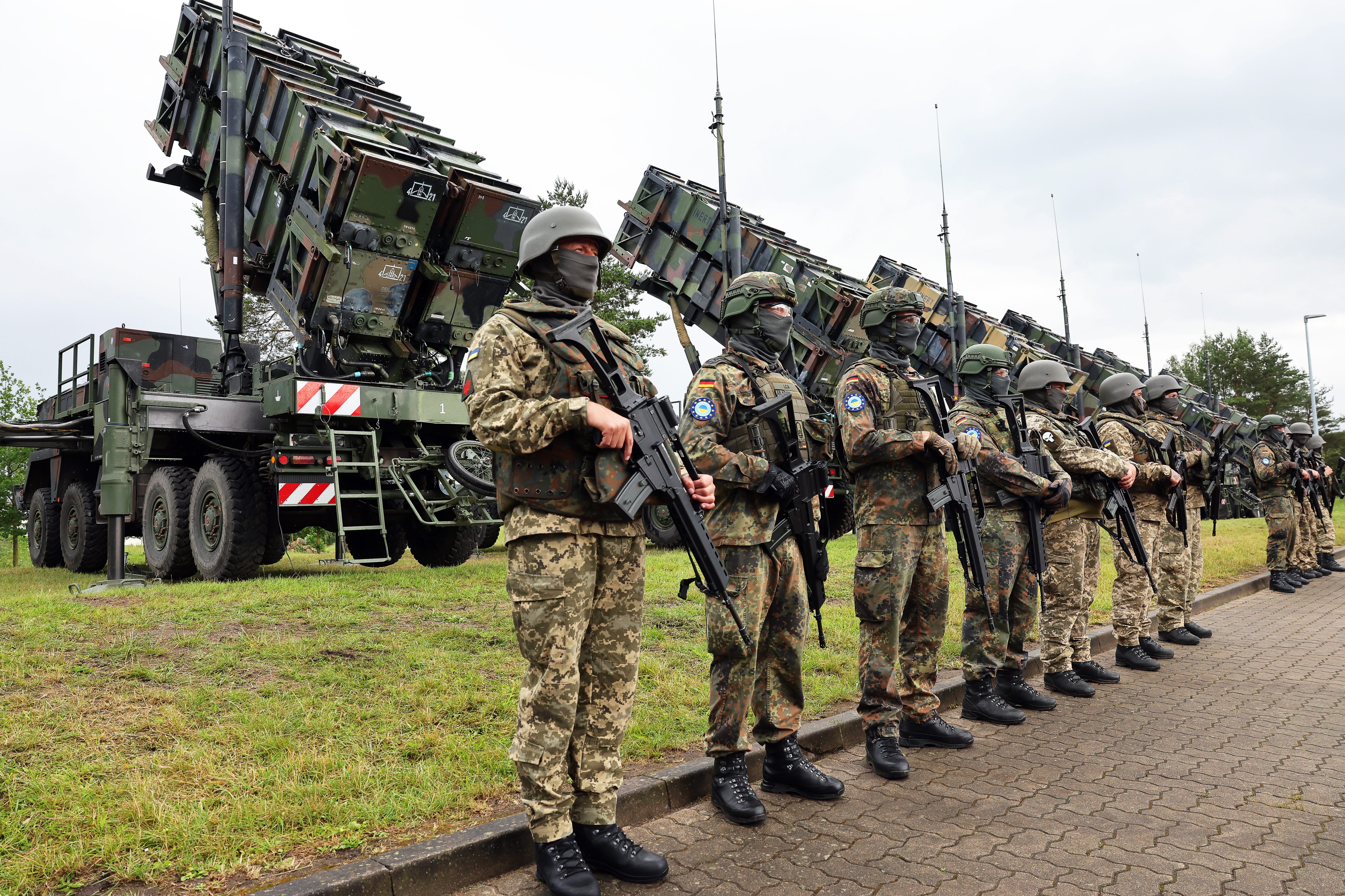 German and Ukrainian soldiers stand in front of Patriot systems at a military training area in Mecklenburg, Germany, in June 2024.