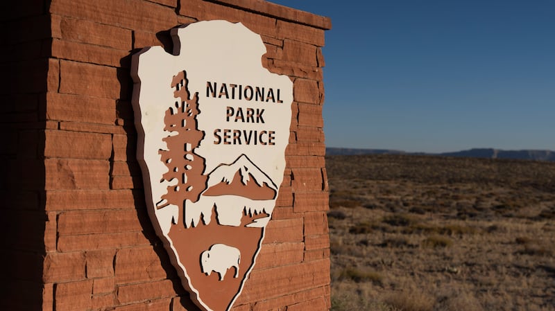 The U.S. National Parks Service logo is displayed at Glen Canyon National Recreation Area on July 10, 2025 in Page, Arizona. Lake Powell, a critical Colorado River reservoir, is only at a third of its capacity as drought conditions in the Southwest worsen. (Photo by Rebecca Noble/Getty Images)