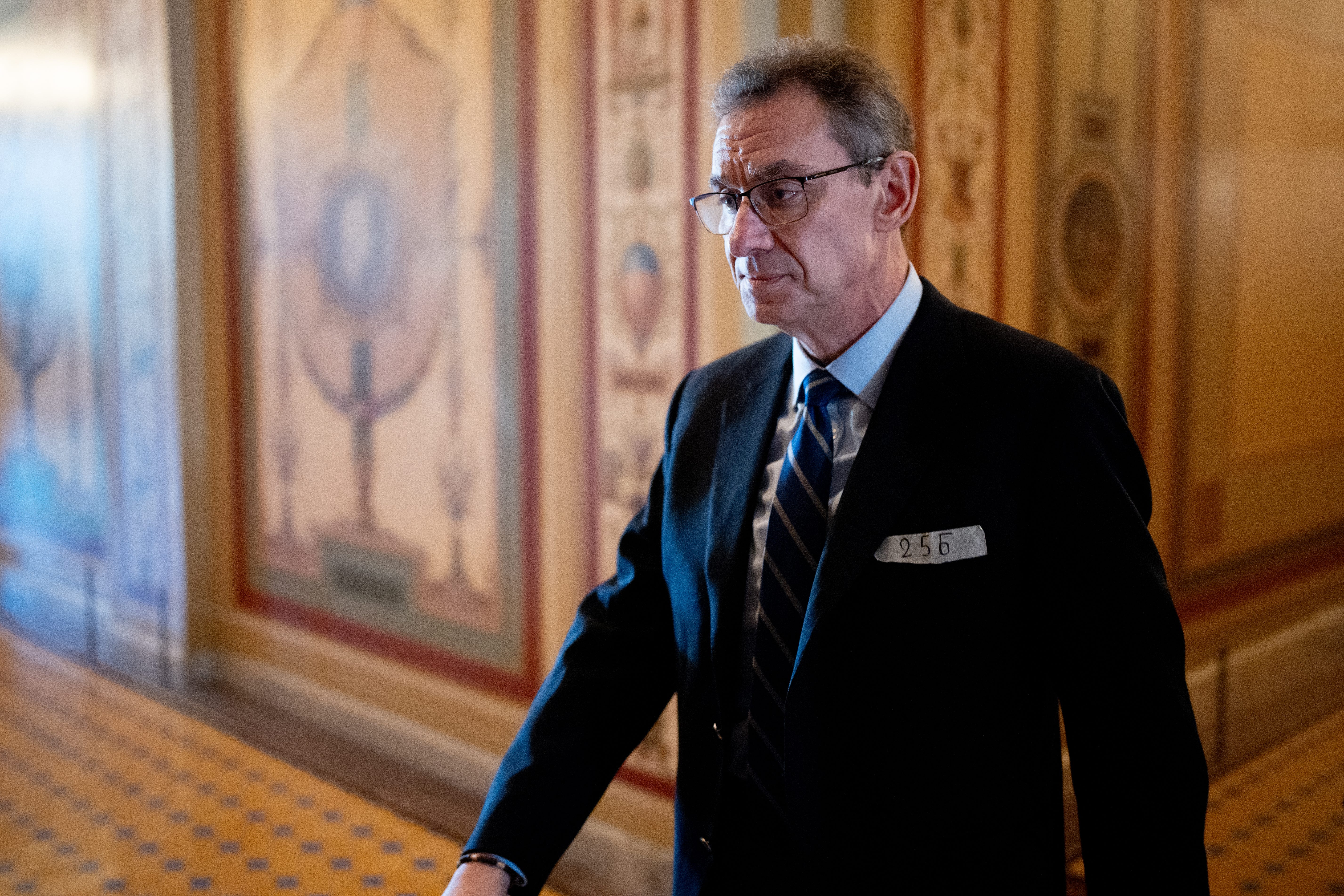 A man walks in a suit