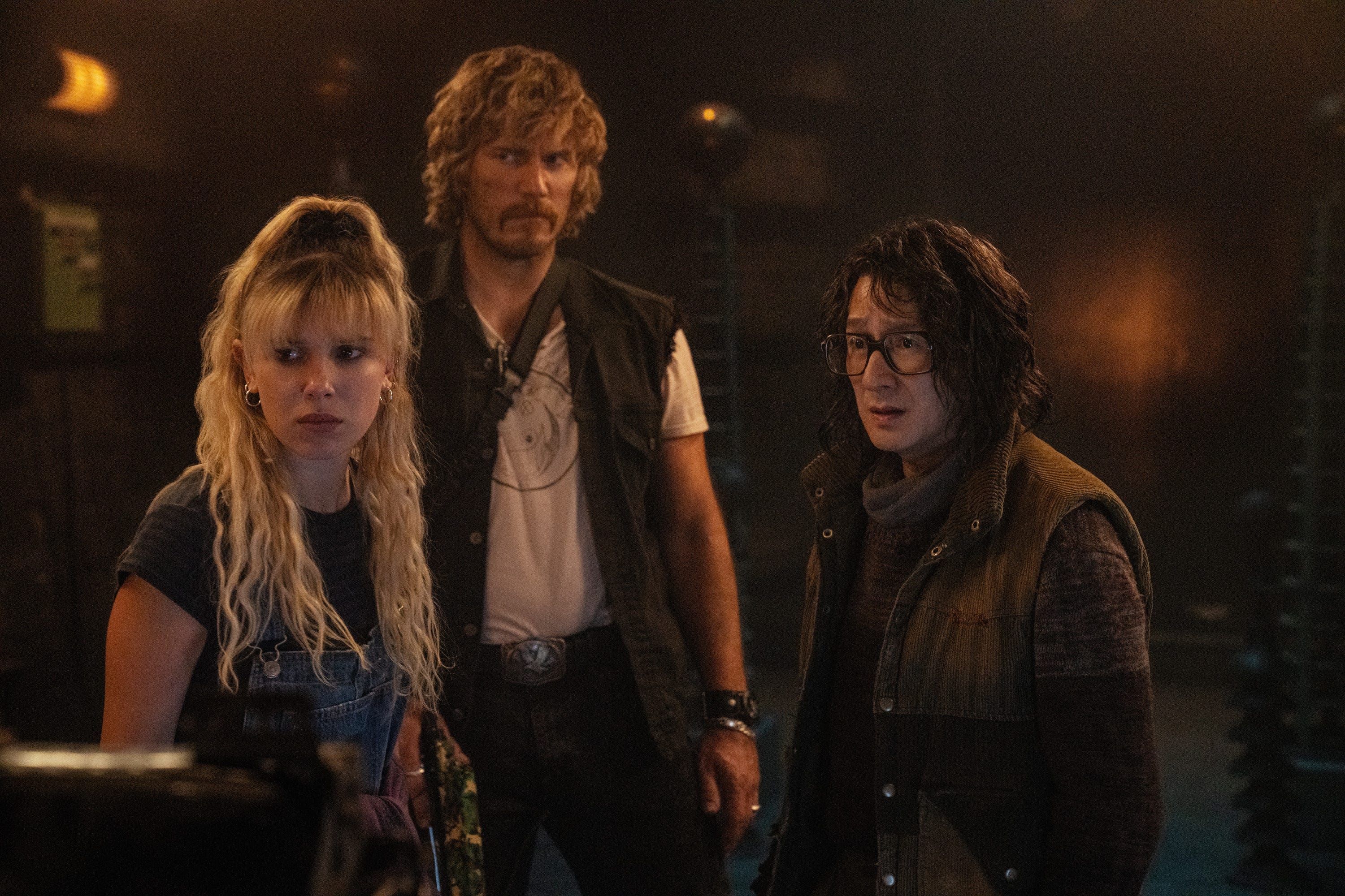 A still from "The Electric State" showing Millie Bobby Brown, Chris Pratt and Ke Huy Quan in retro outfits.