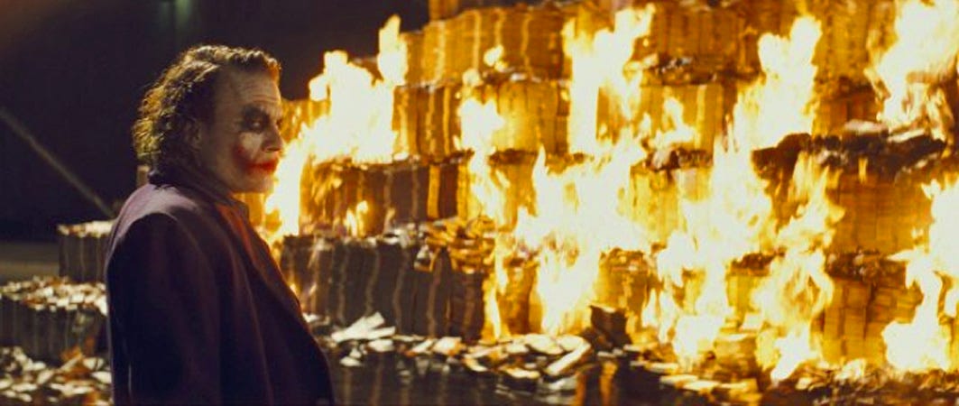 batman joker burning money fire