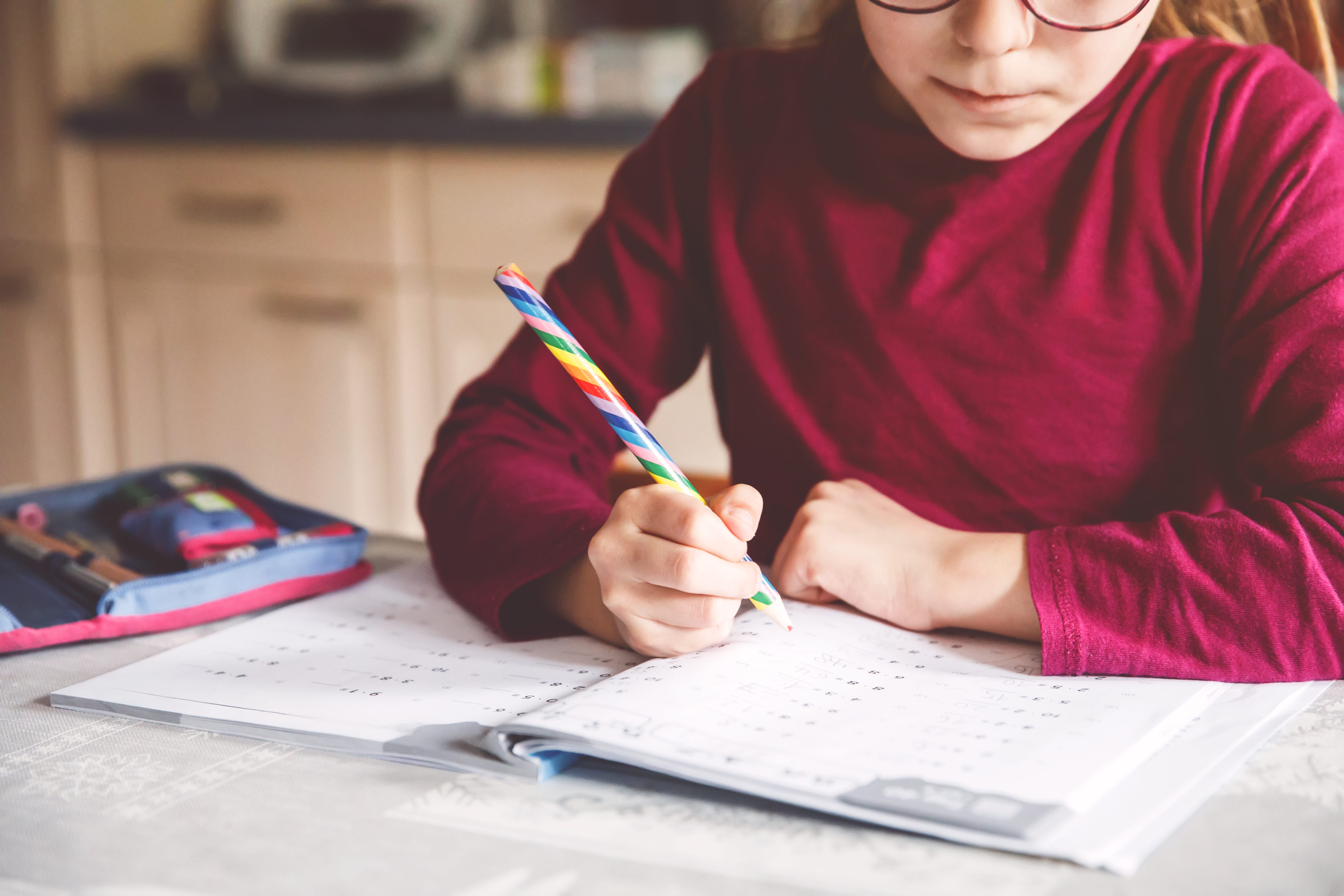 Little girl doing math homework
