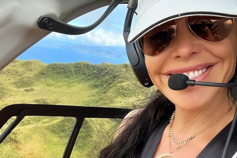 Lauren Sánchez in a helicopter.