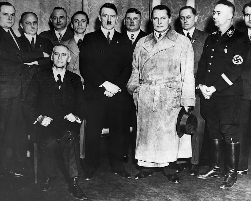 Hitler, newly appointed German Chancellor, stands with senior members of the Nazi party.