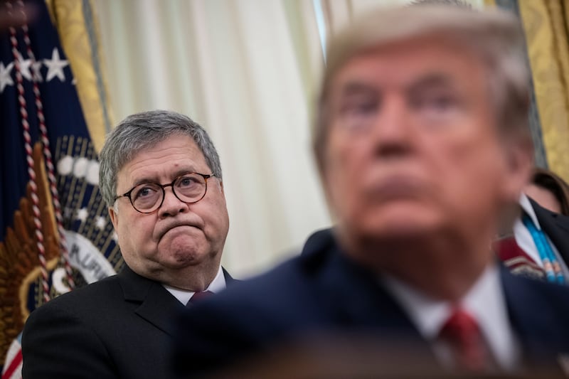 U.S. Attorney General William Barr and President Donald Trump attend a signing ceremony for an executive order in the Oval Office of the White House on November 26, 2019 in Washington, D.C.