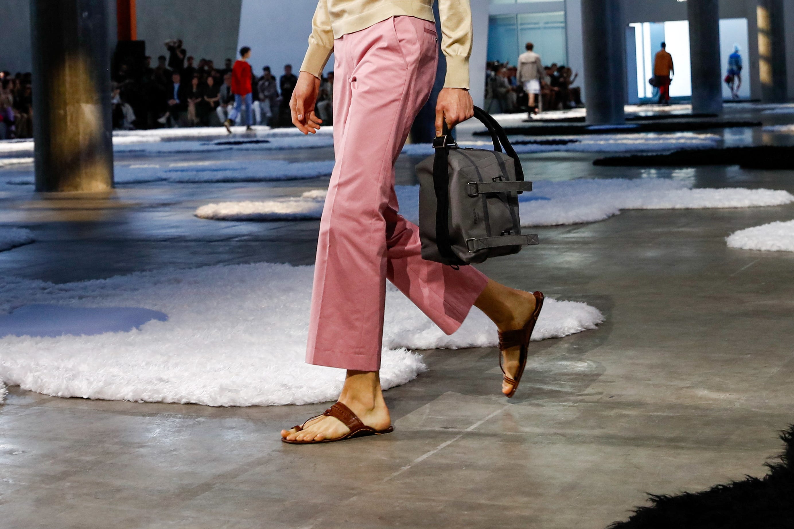 A model presents a creation from Prada Spring-Summer 2026 menswear collection during the Milan Fashion Week in Milan, Italy, June 22, 2025.