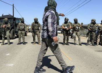 Protesters and federal agents clash during raid at Southern California farm