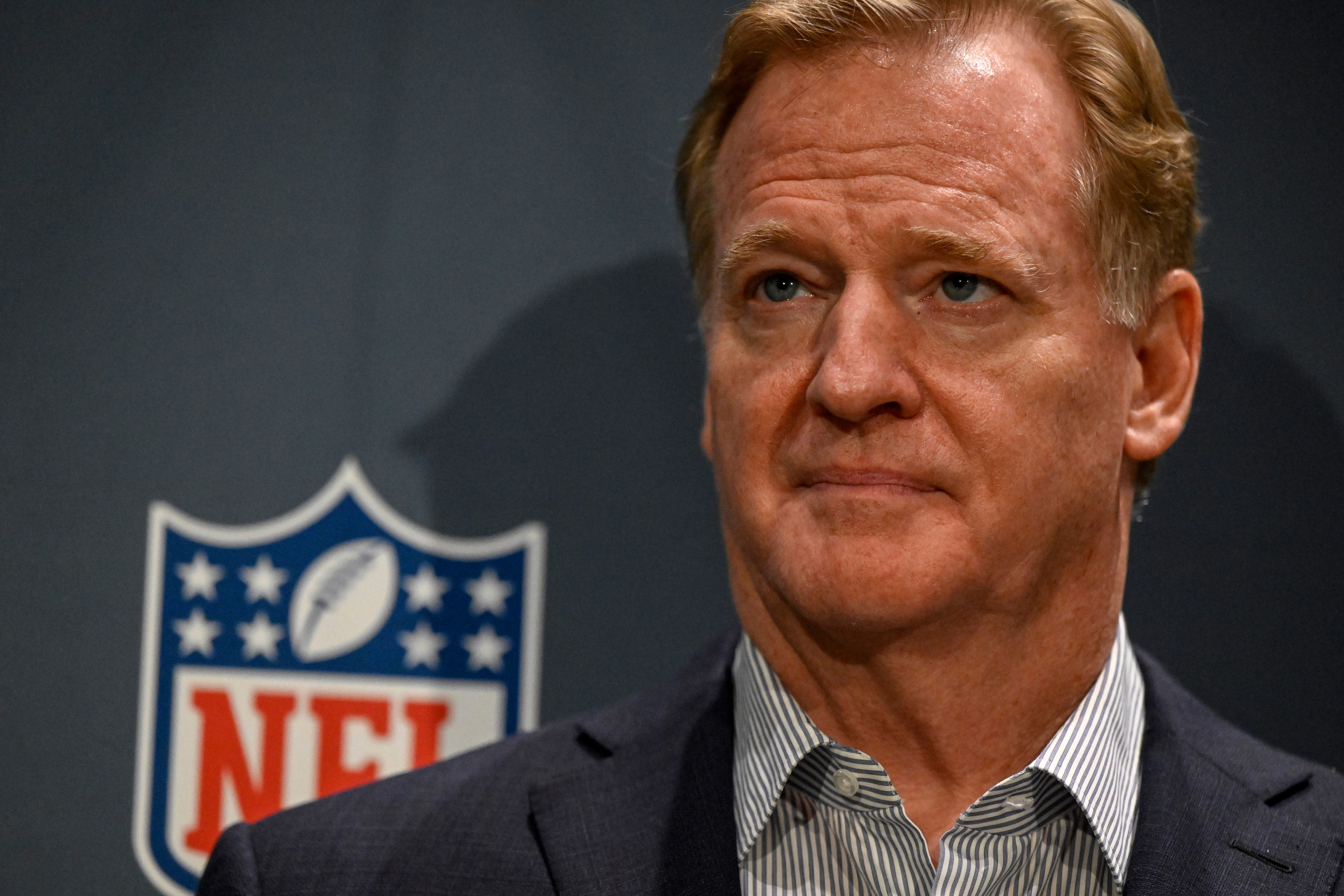 NFL commissioner Roger Goodell in a suit jacket looking attentive